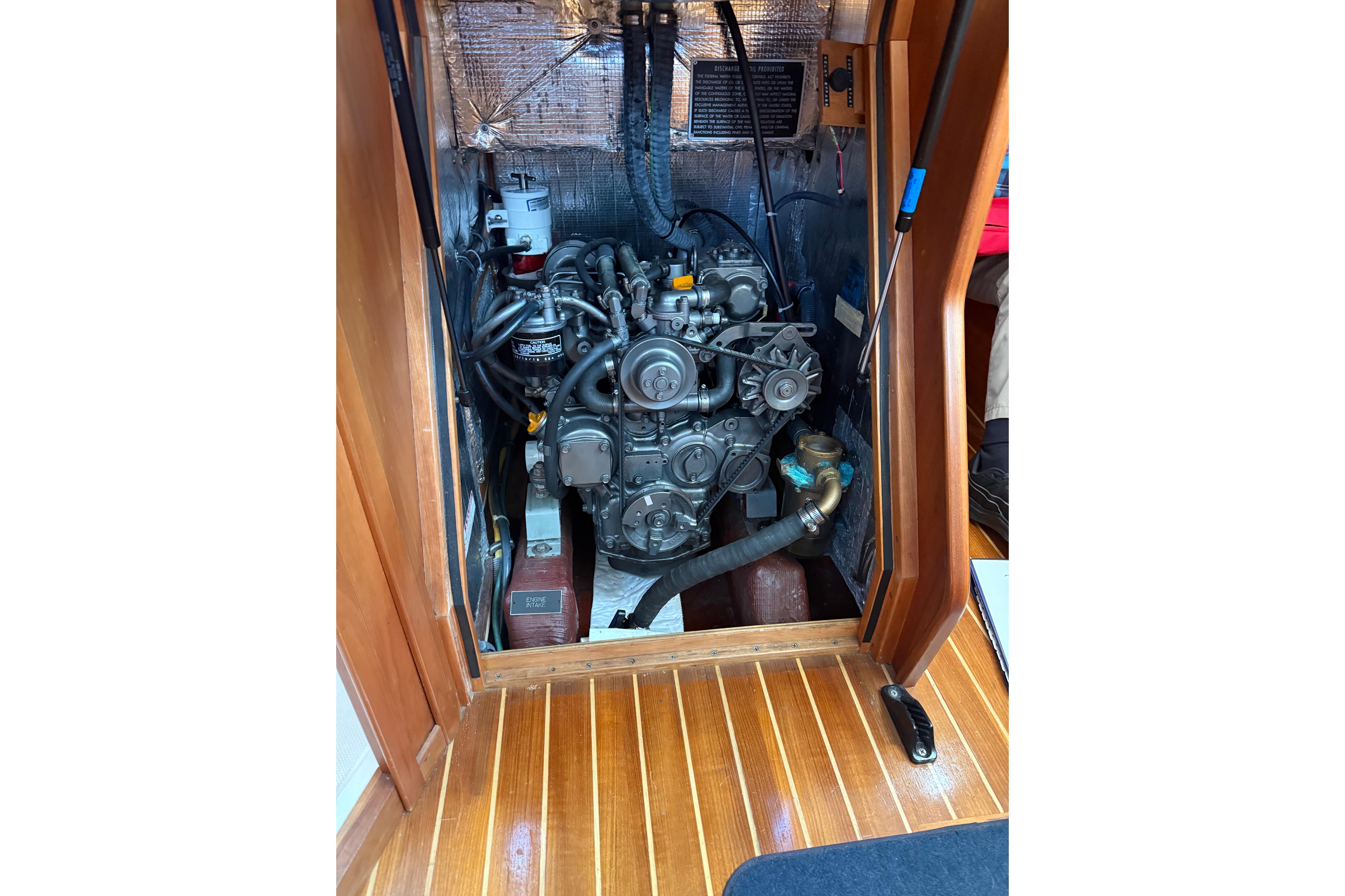 Engine compartment of a 2004 Sabre 386 sailboat, showcasing detailed mechanical components.