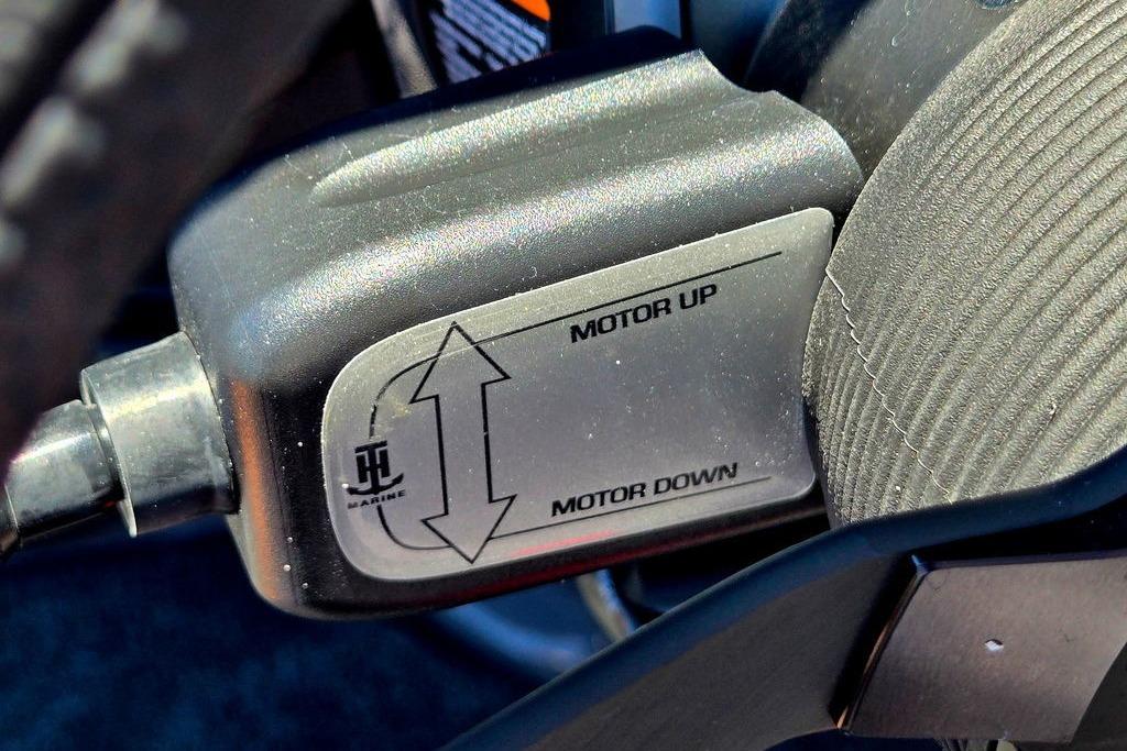Close-up of Skeeter ZXE20 2026 motor control switch with "Motor Up" and "Motor Down" labels.
