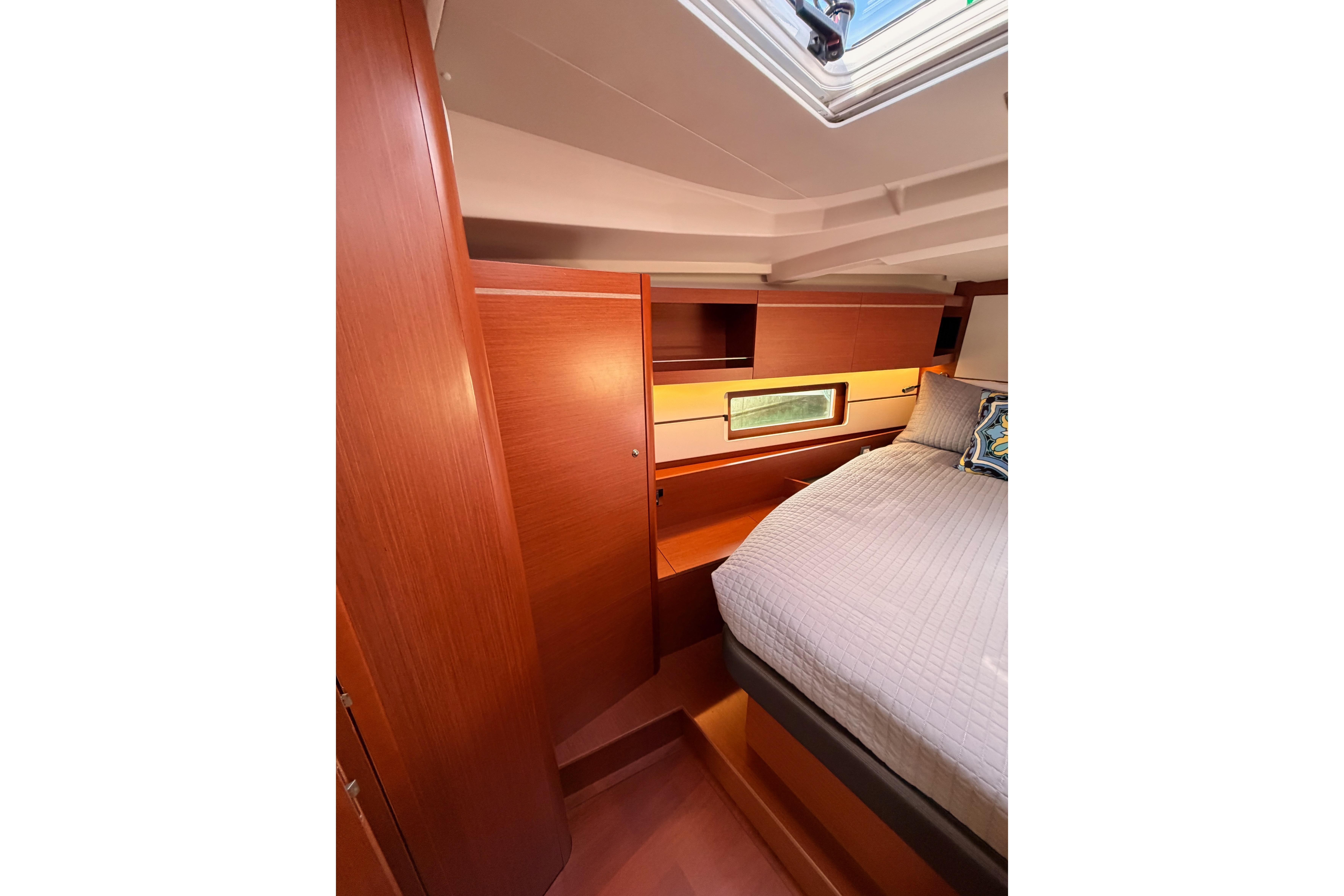 Luxurious cabin interior of 2020 Beneteau Oceanis 46.1 yacht with wood finish.