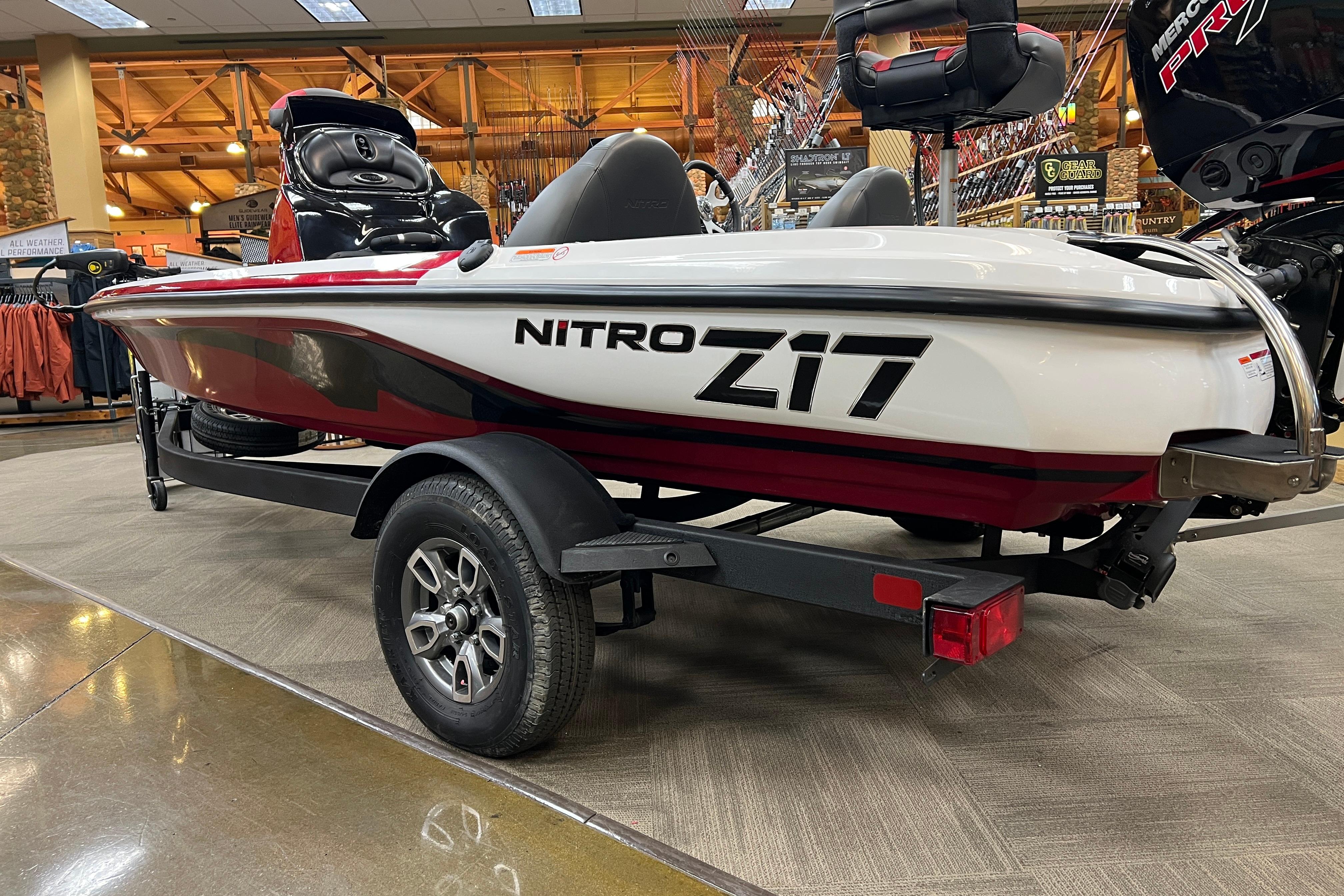 2026 Nitro Z17 boat on display in a showroom, featuring sleek design and trailer.