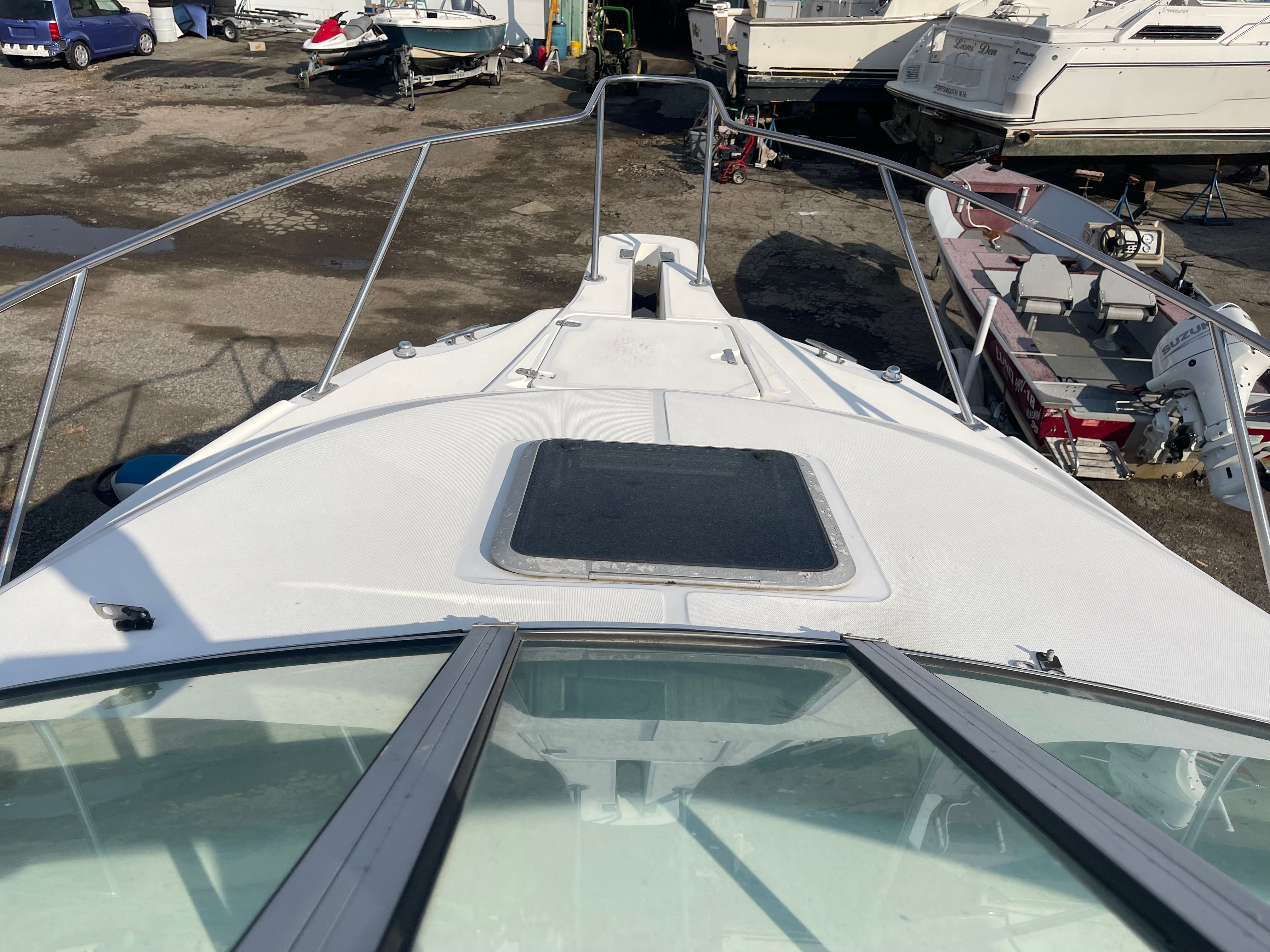 2001 Boston Whaler 26 Conquest on a boat storage lot.