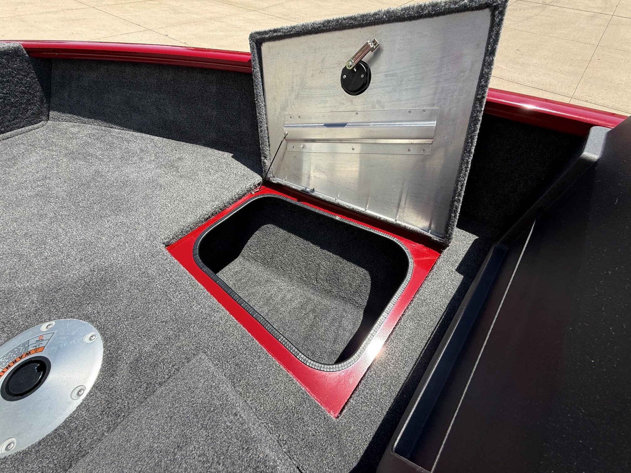 2024 Tracker Pro Guide V175 boat with open storage compartment.