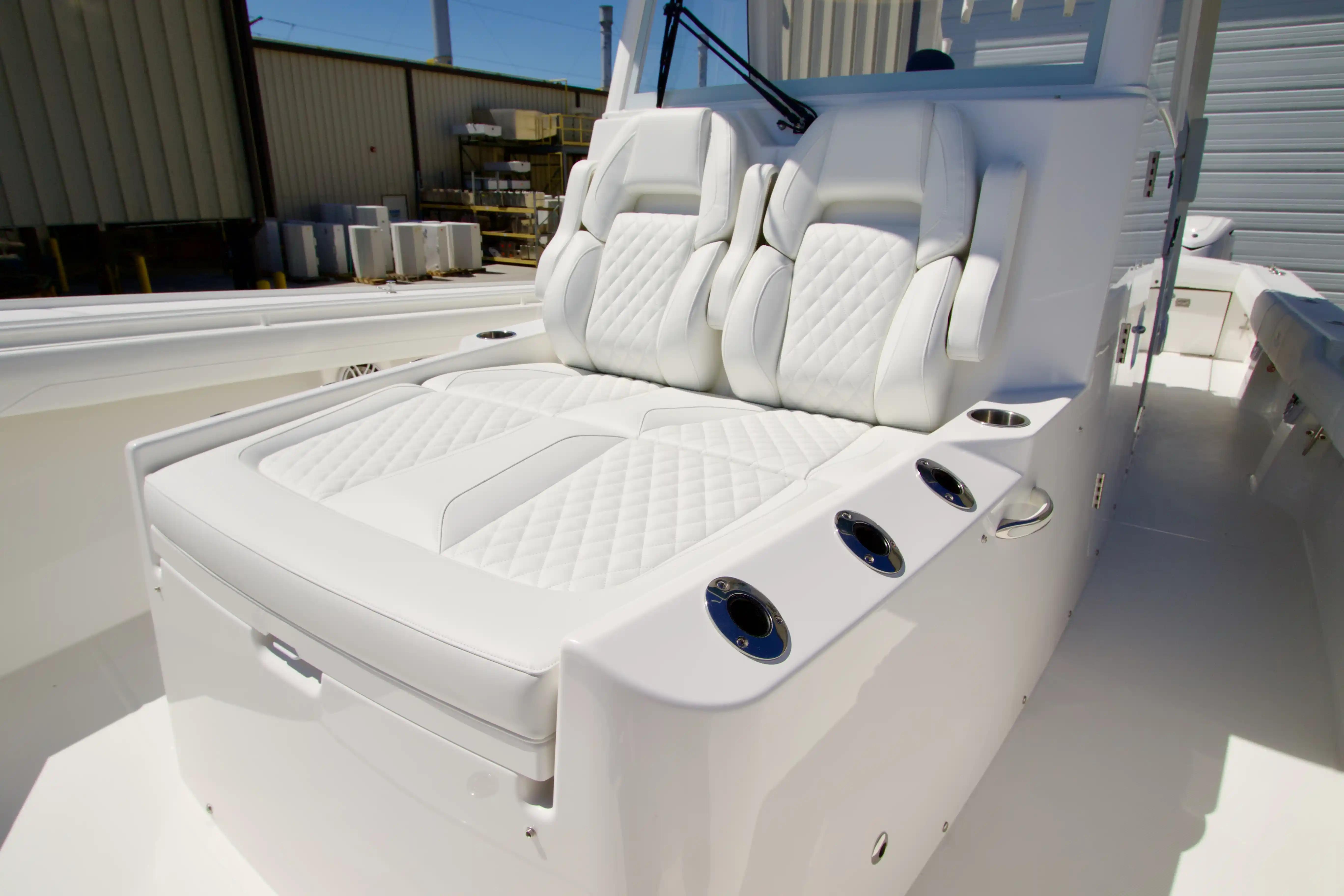 Luxurious seating on 2027 Regulator 35 boat, featuring white quilted upholstery and sleek design.