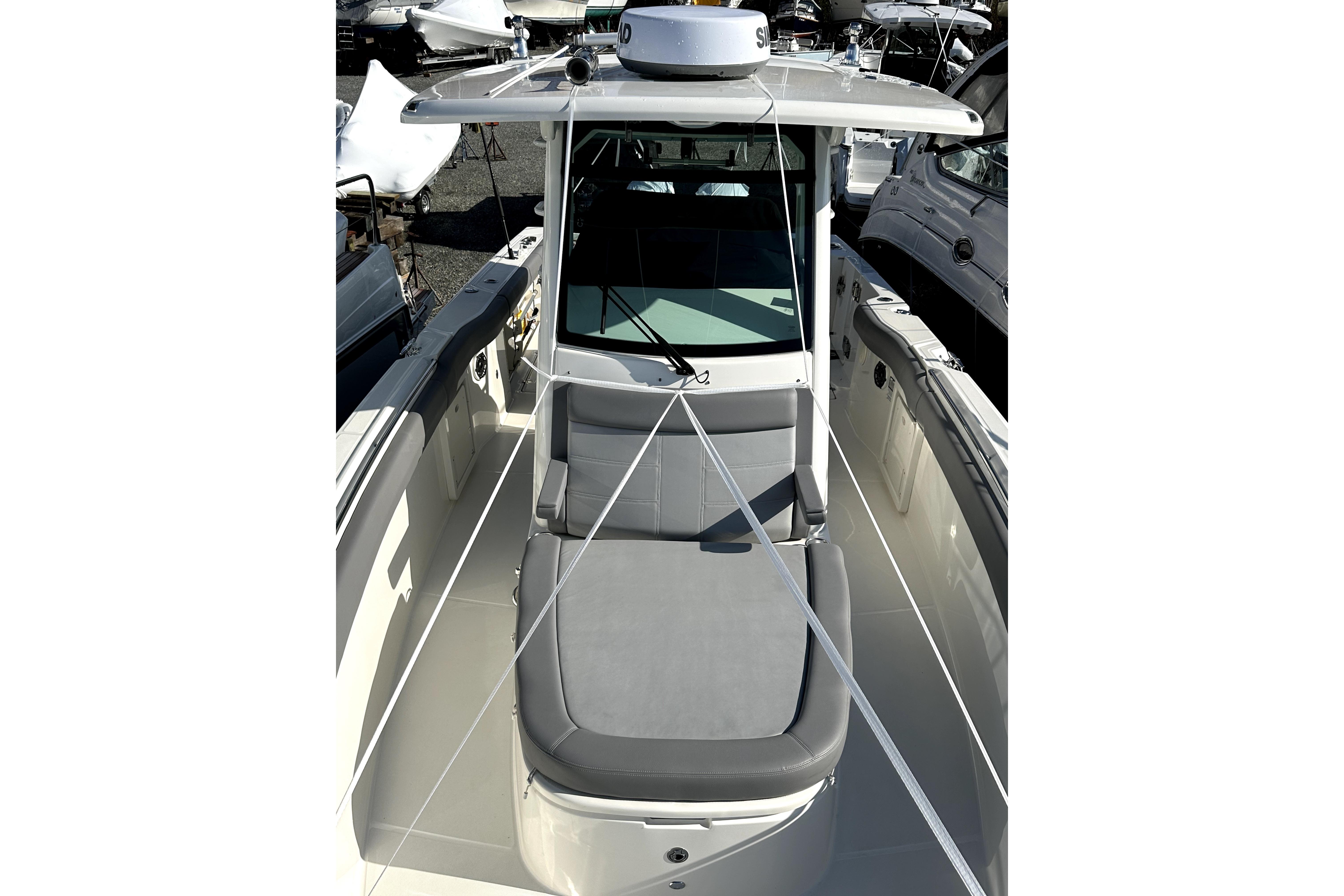 2023 Boston Whaler OUTRAGE boat with sleek design and spacious seating.