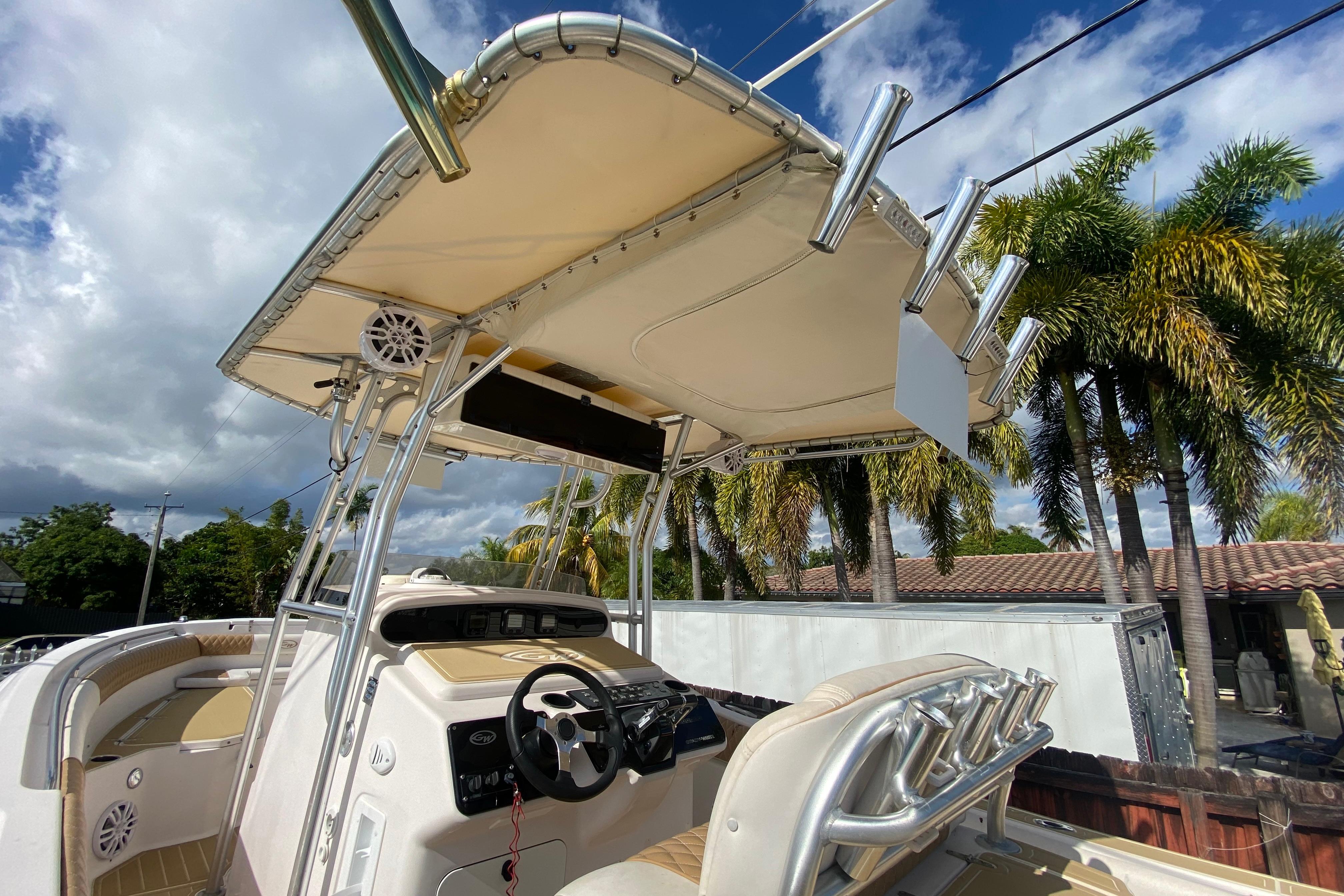 2004 Grady-White Canyon 283 boat with canopy, steering console, and rod holders.