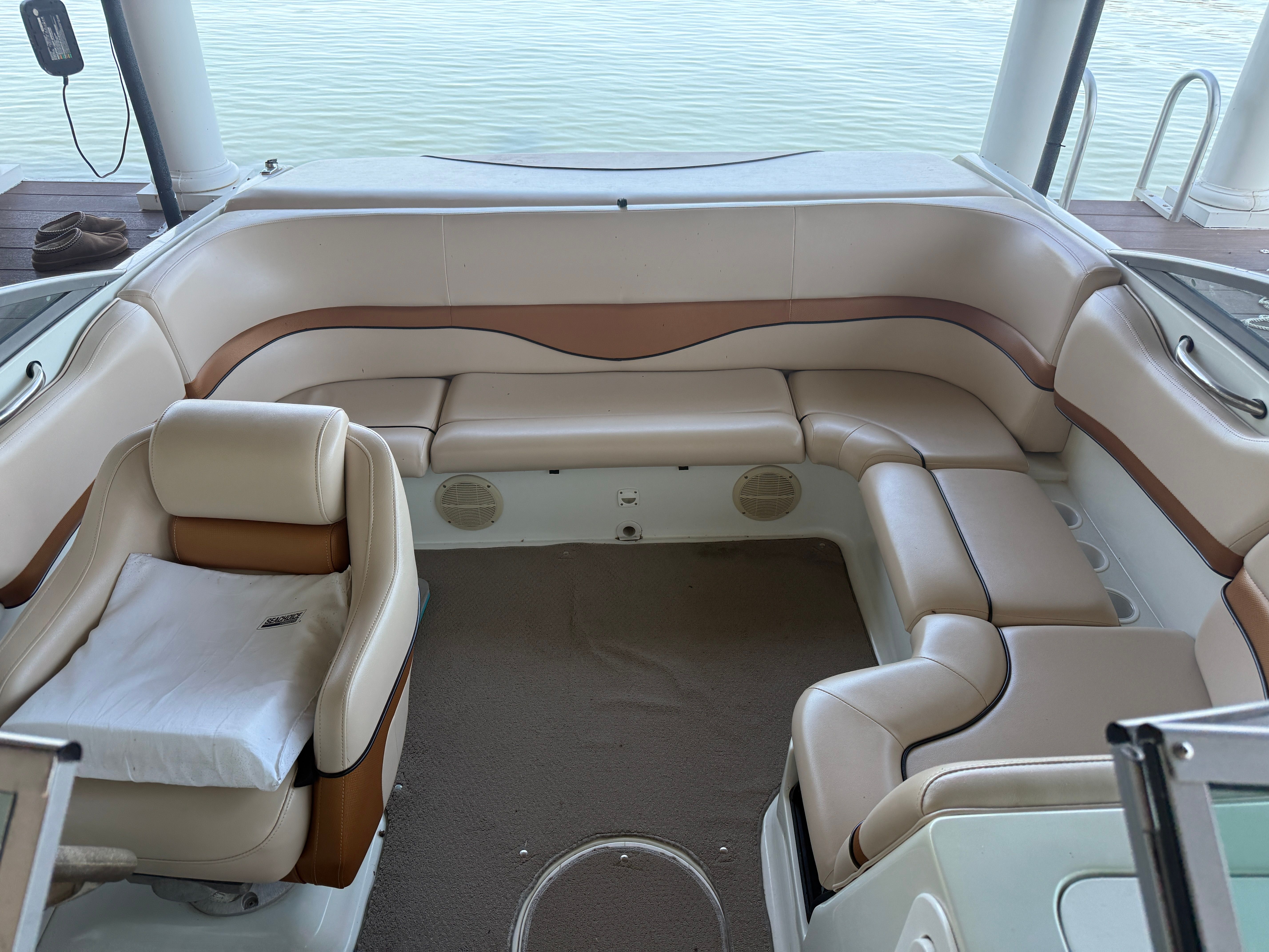 Interior of a 2000 Starcraft Next Star 19 boat with beige and brown seating.