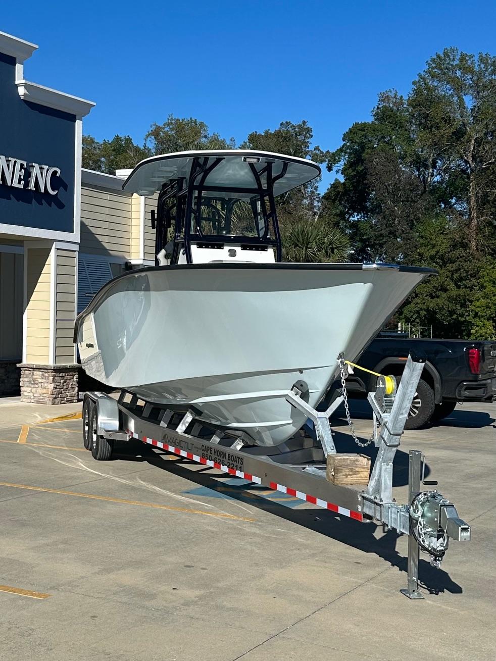 2025 Cape Horn 28XS boat on trailer outside a building, sunny day.