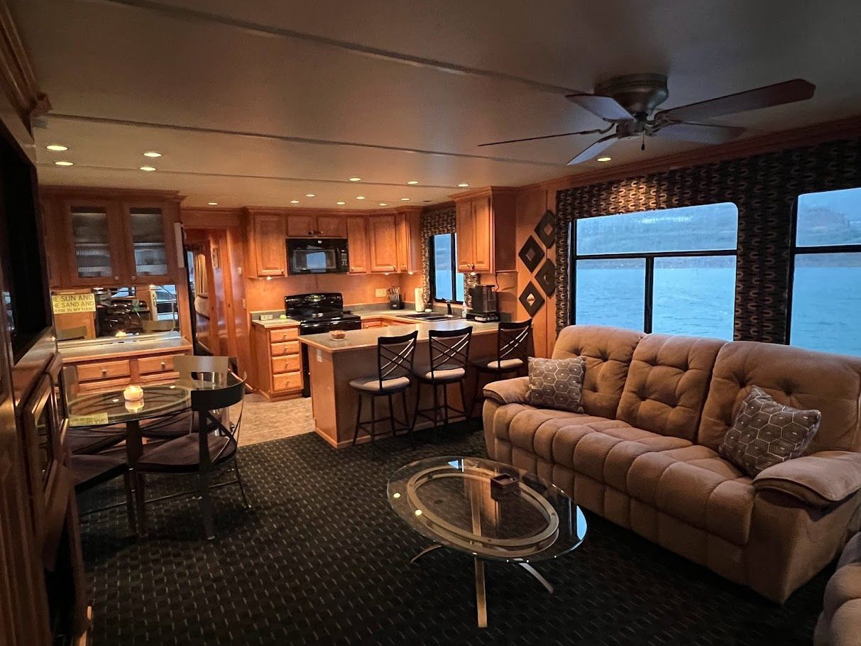 Interior of a 2006 Summersun Houseboats 16x68, cozy living room and kitchen.