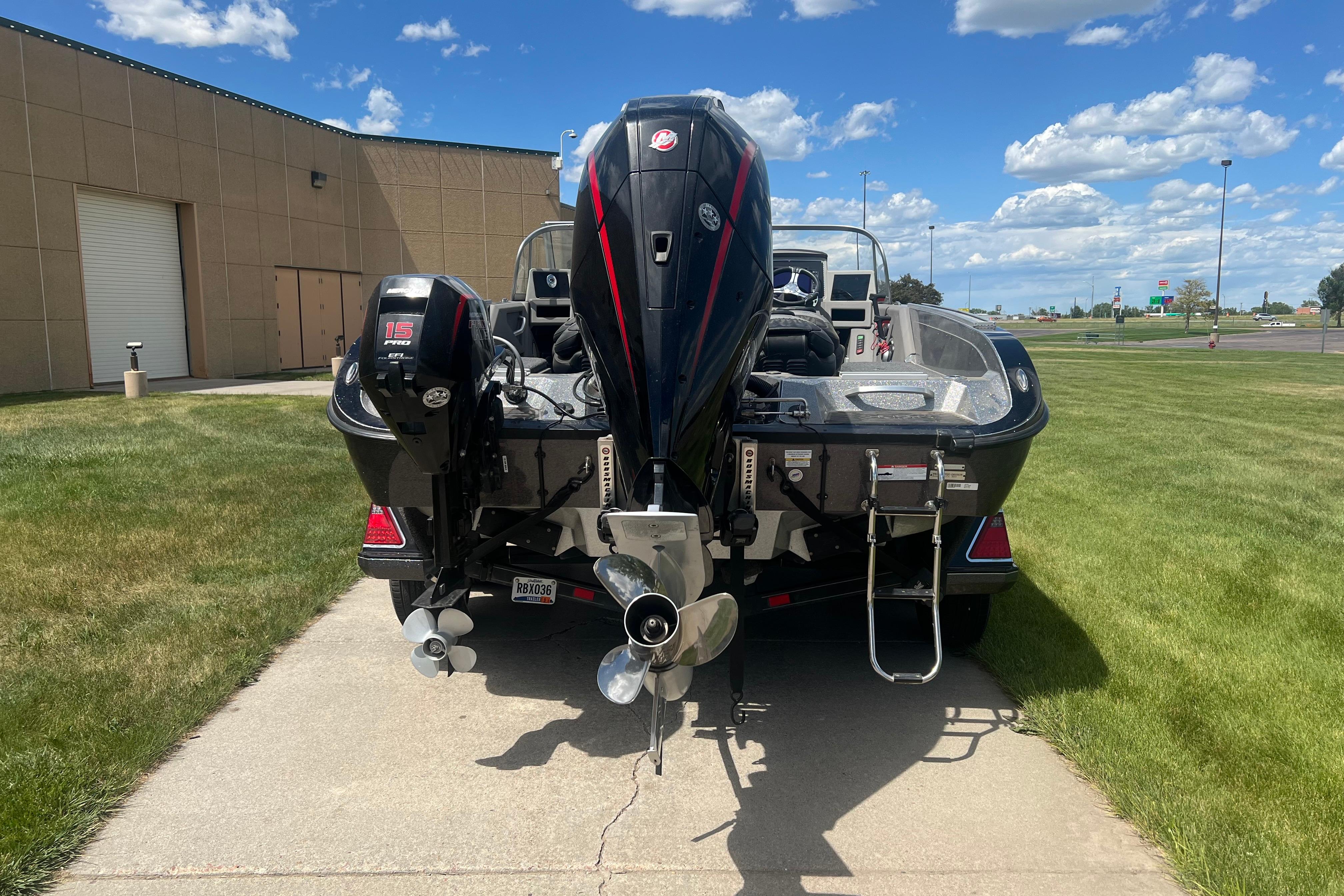 2023 Ranger 620FS Pro boat with dual outboard motors on a sunny day.