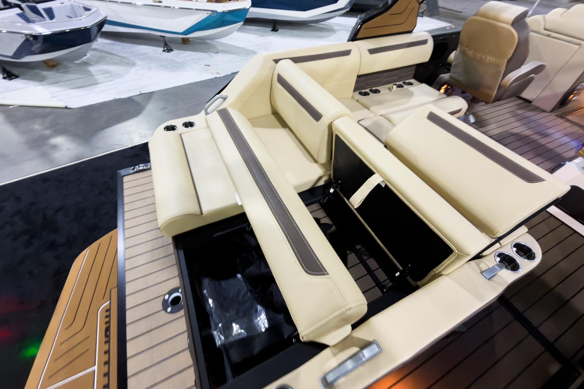 Luxurious seating on 2026 Montara Surf Boss EVO SLDH 25' boat, featuring beige upholstery.