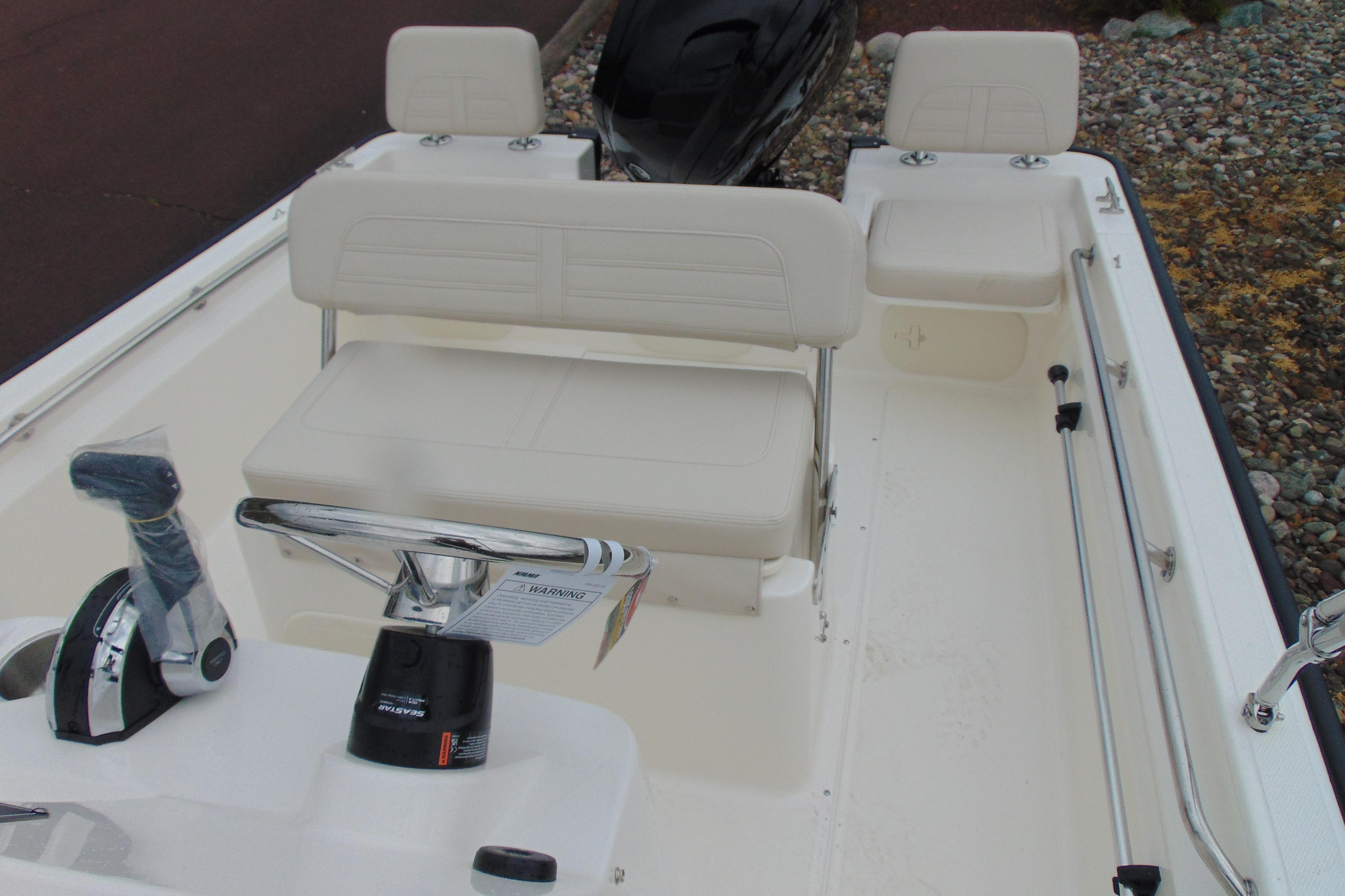 2026 Boston Whaler 170 Montauk boat interior with seating and controls.