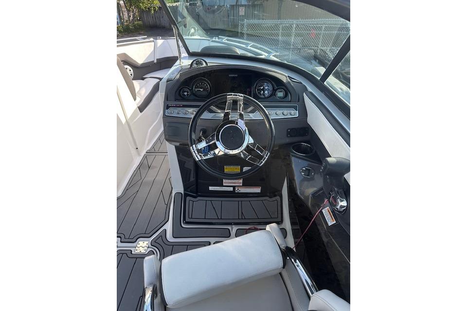 2022 Monterey 255SS Super Sport boat cockpit with modern steering and dashboard controls.
