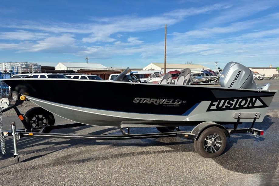 2024 Starweld 16 Fusion SC Pro boat on trailer, featuring Honda outboard motor.