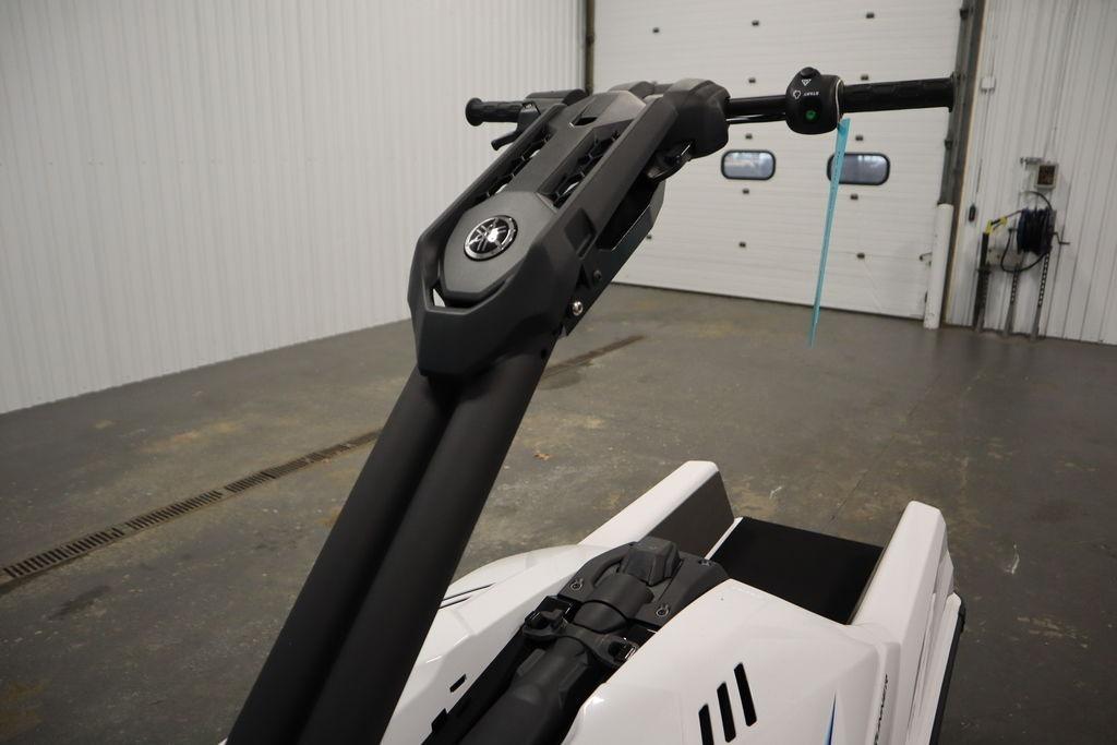 2025 Yamaha WaveRunner SuperJet in a garage, showcasing handlebars and sleek design.