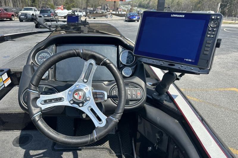 2016 Triton 20 TrX boat dashboard with steering wheel and Lowrance HDS display.