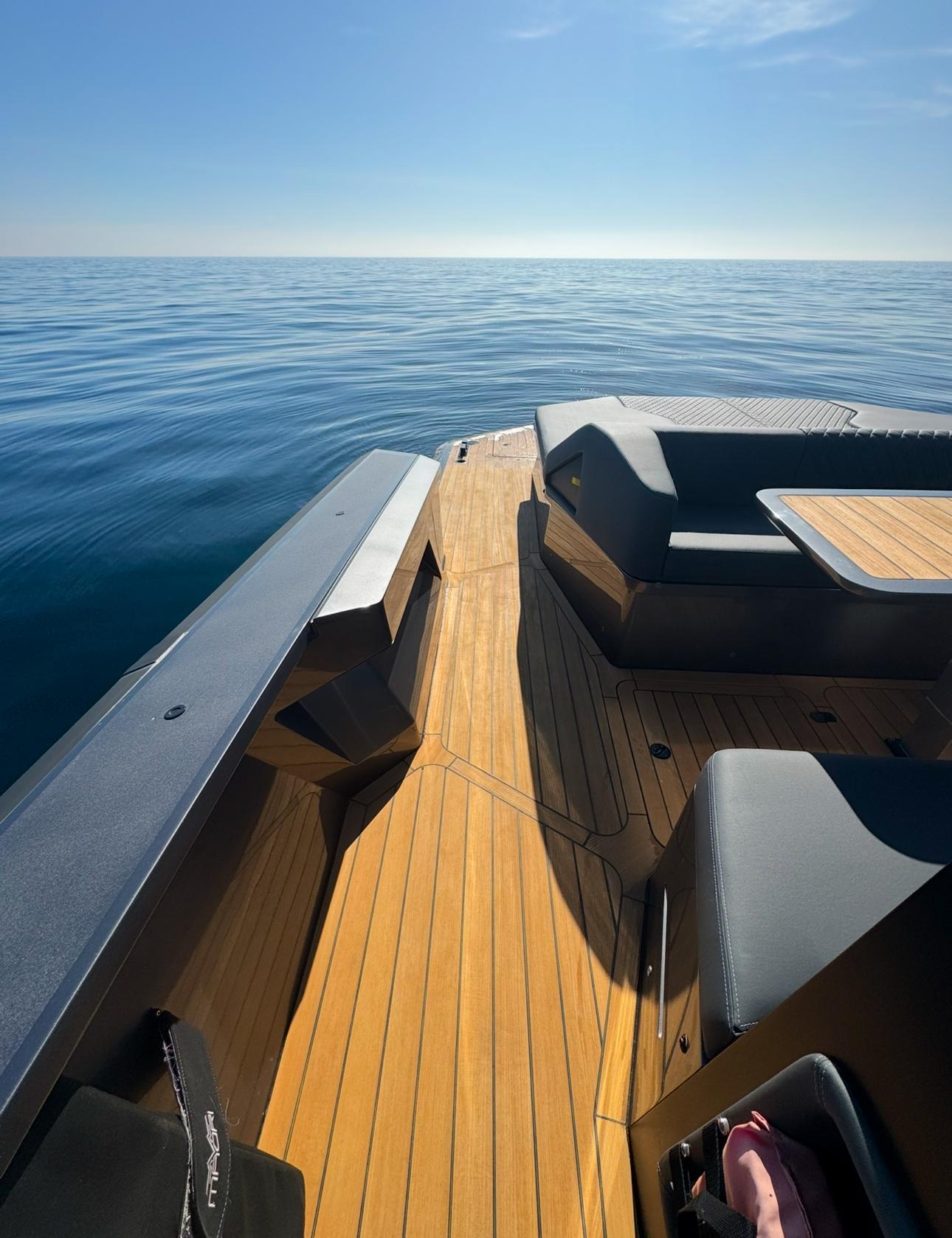 2019 Maori 54ft Family yacht on calm sea, featuring spacious deck and seating.