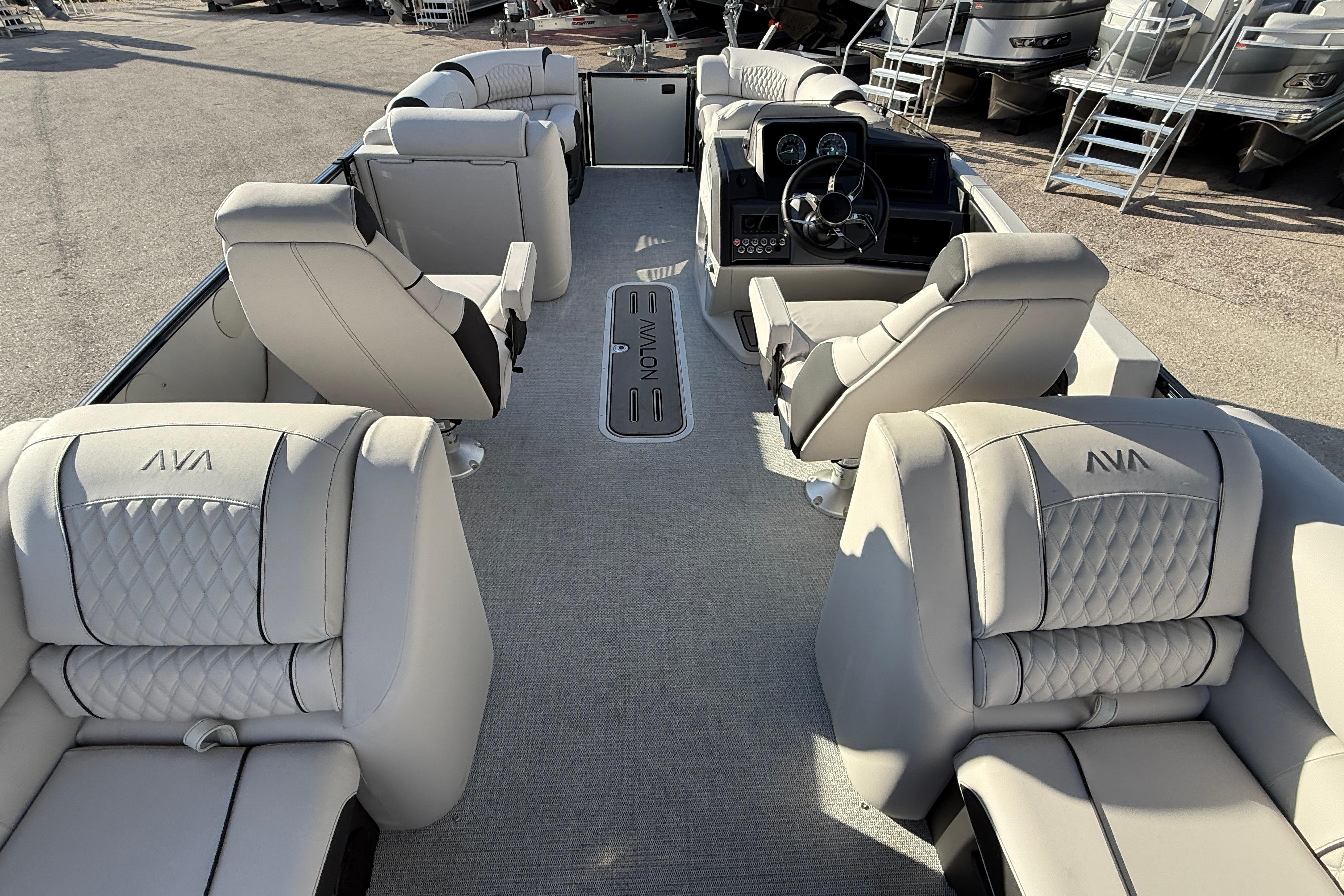 2026 Avalon 2385 Catalina Quad Lounger interior with luxurious seating and modern helm.
