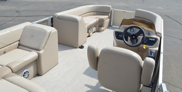 2018 Tahoe LTZ 2285 CR pontoon boat interior with beige seating and steering console.
