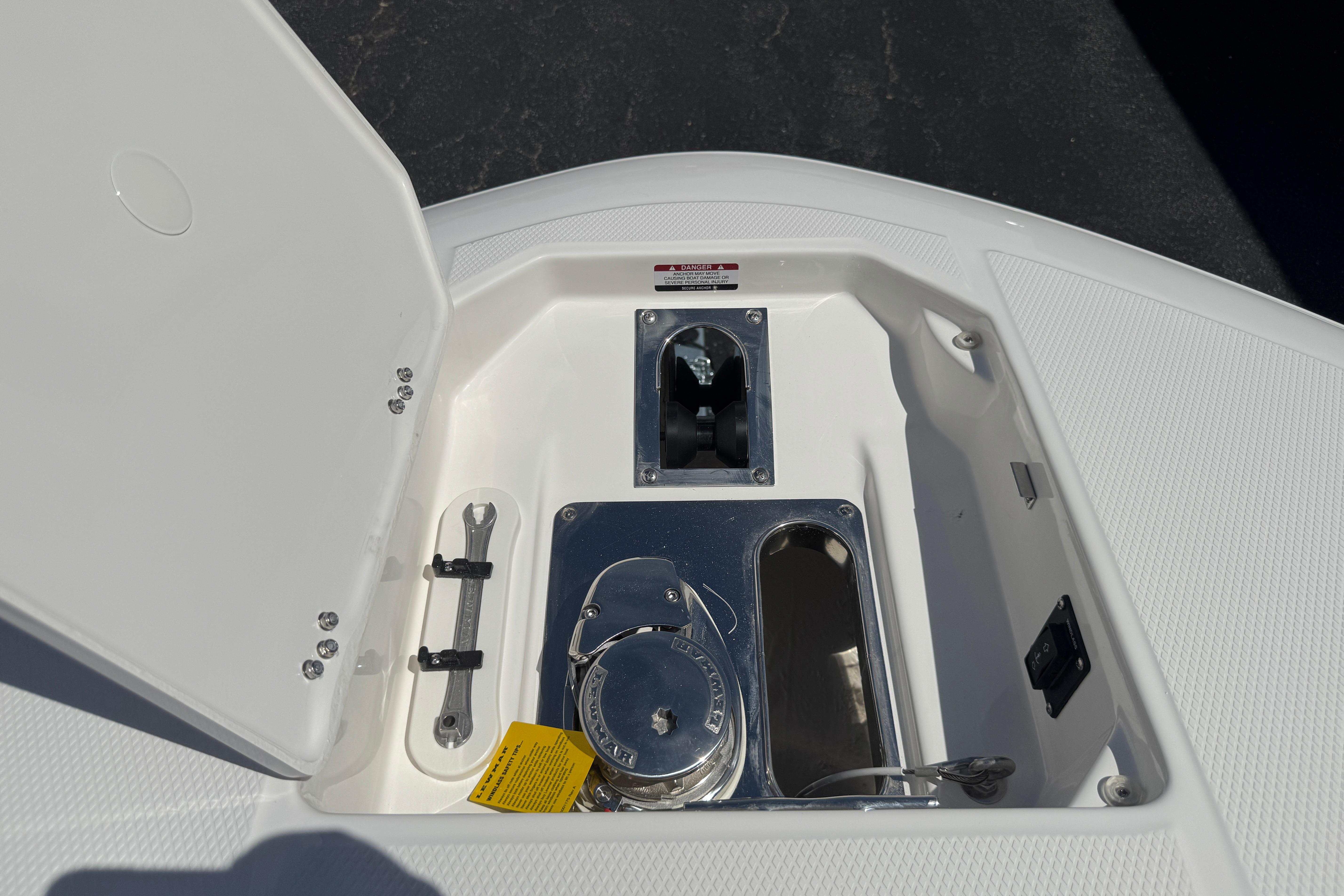 2026 Robalo R250 Center Console anchor locker with tools and winch system.