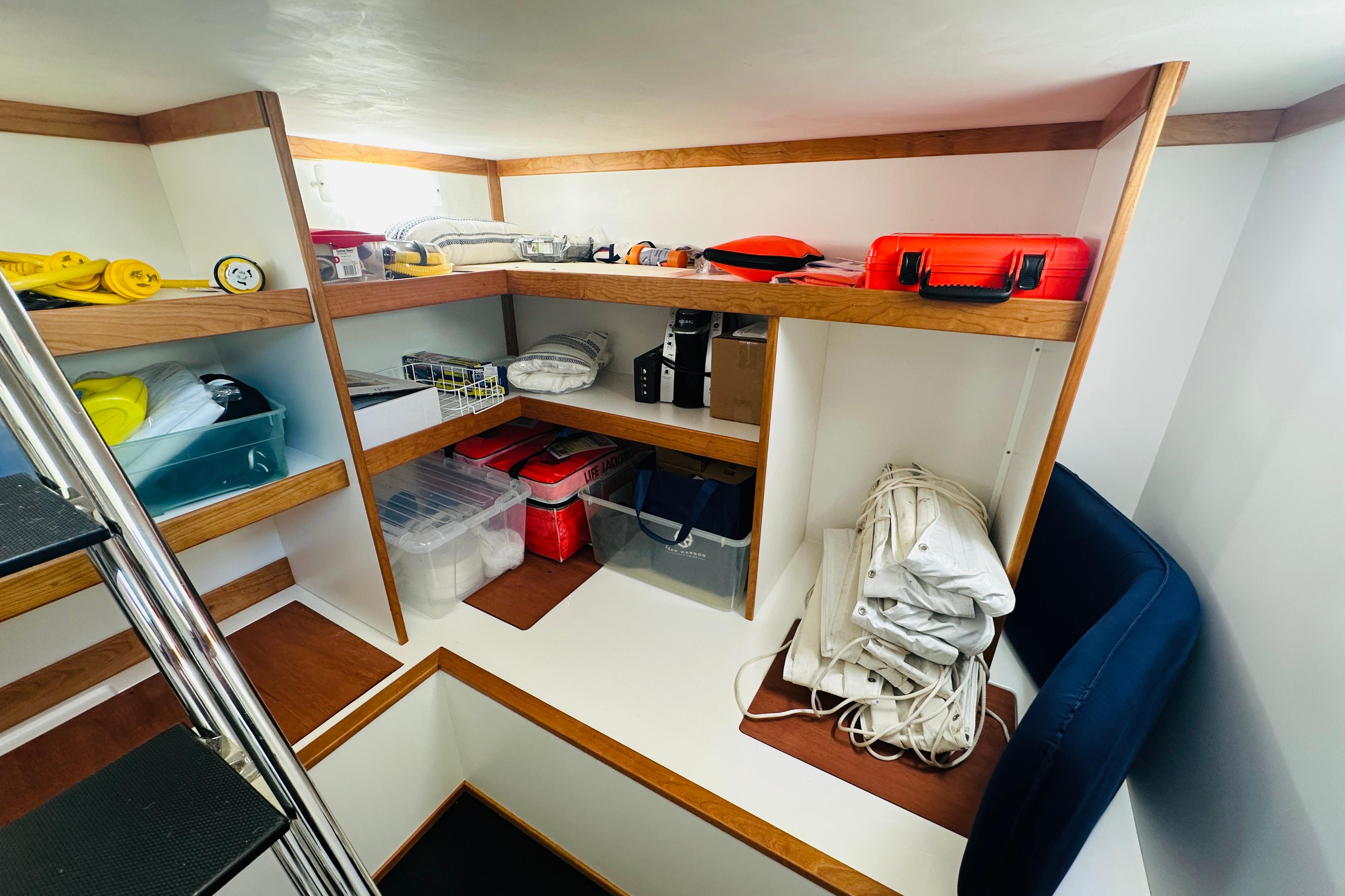 Storage area in 2025 Sabre 48 Salon Express yacht with organized shelves and equipment.