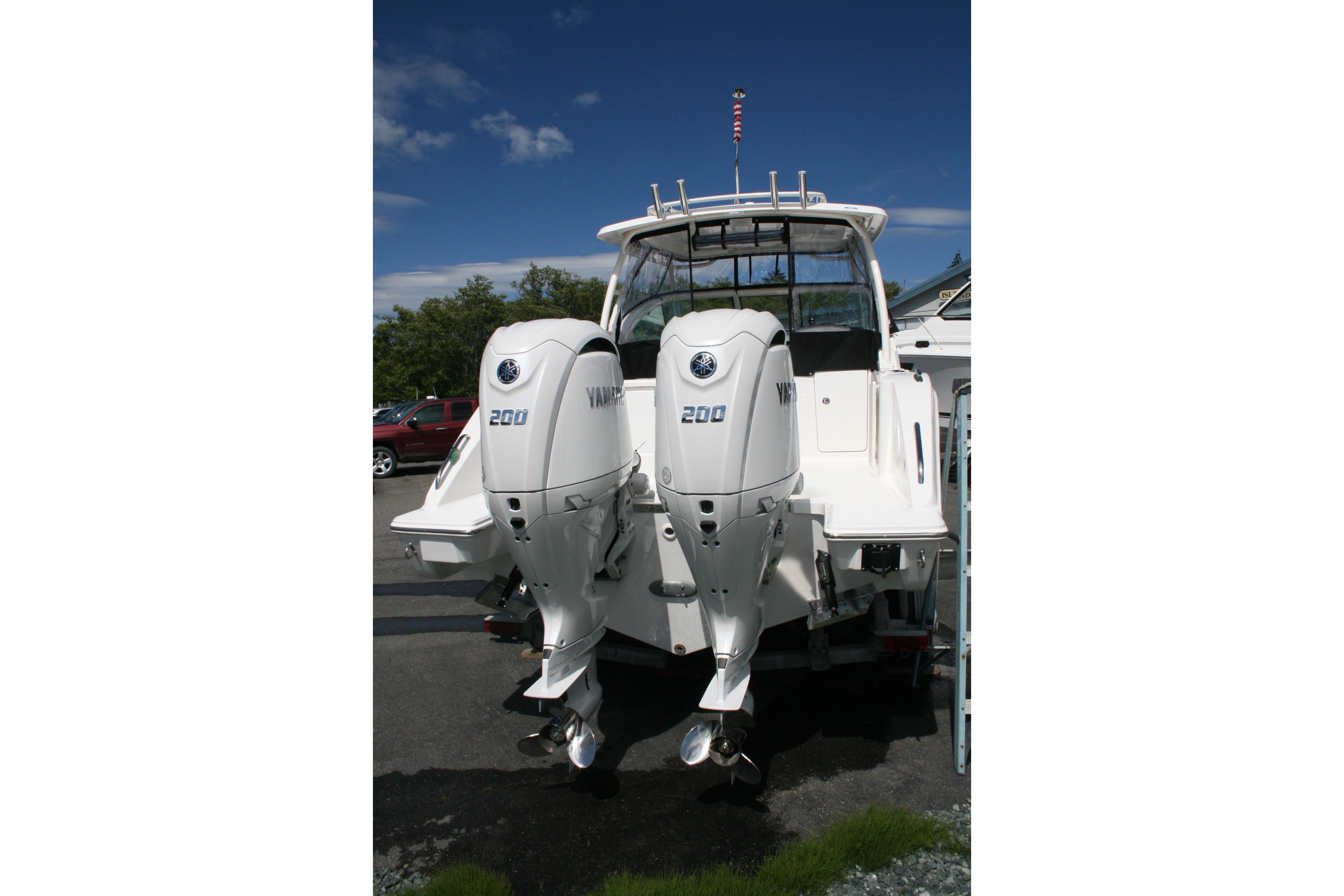 2026 Pursuit DC 266 Dual Console boat with twin Yamaha 200 engines.