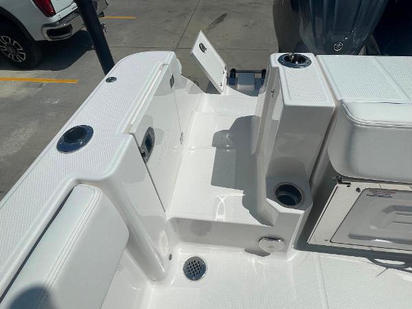 2023 Robalo R270 boat deck with storage compartments and cup holders.