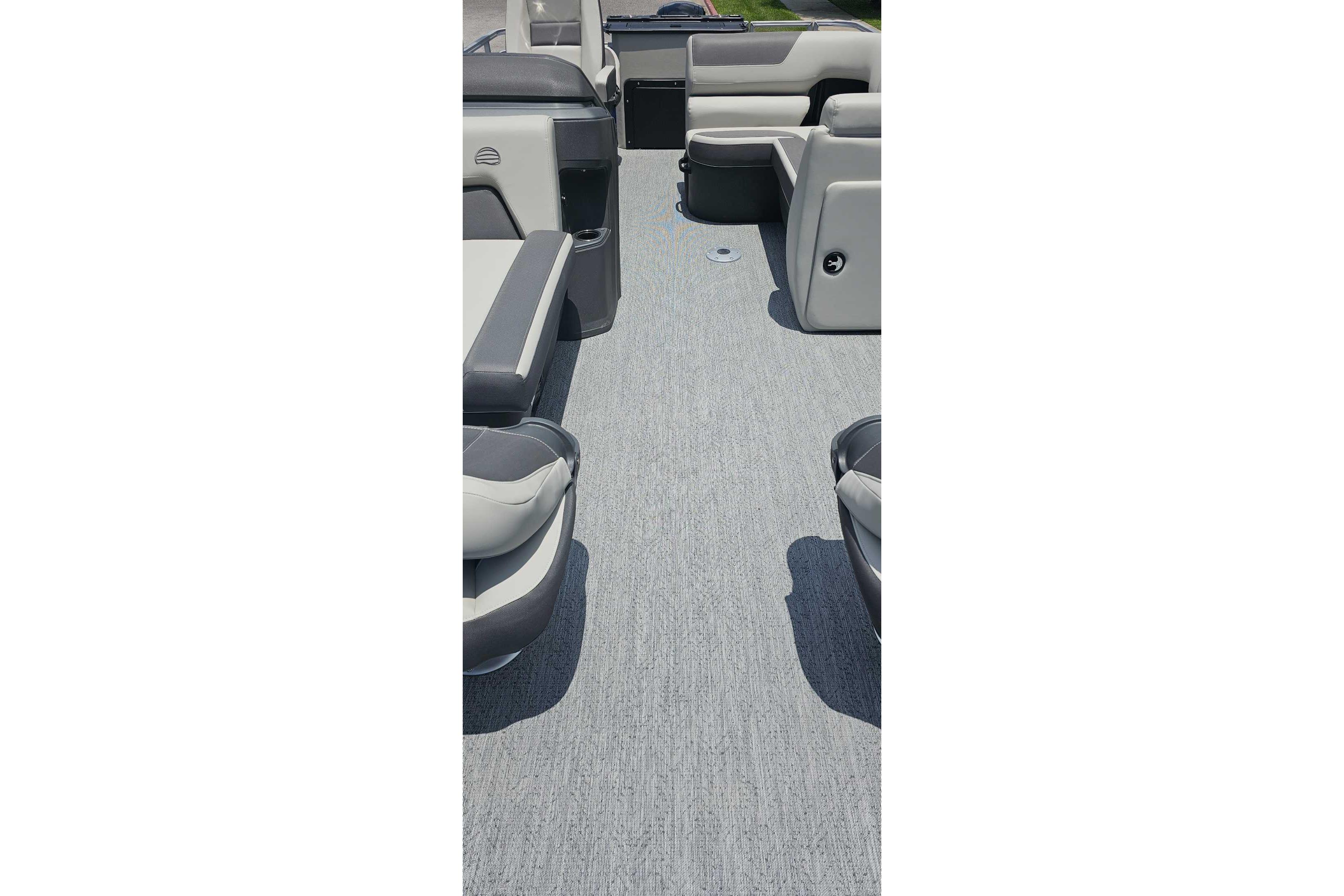 2026 Sun Tracker Fishin' Barge 20 DLX interior with spacious seating and modern design.