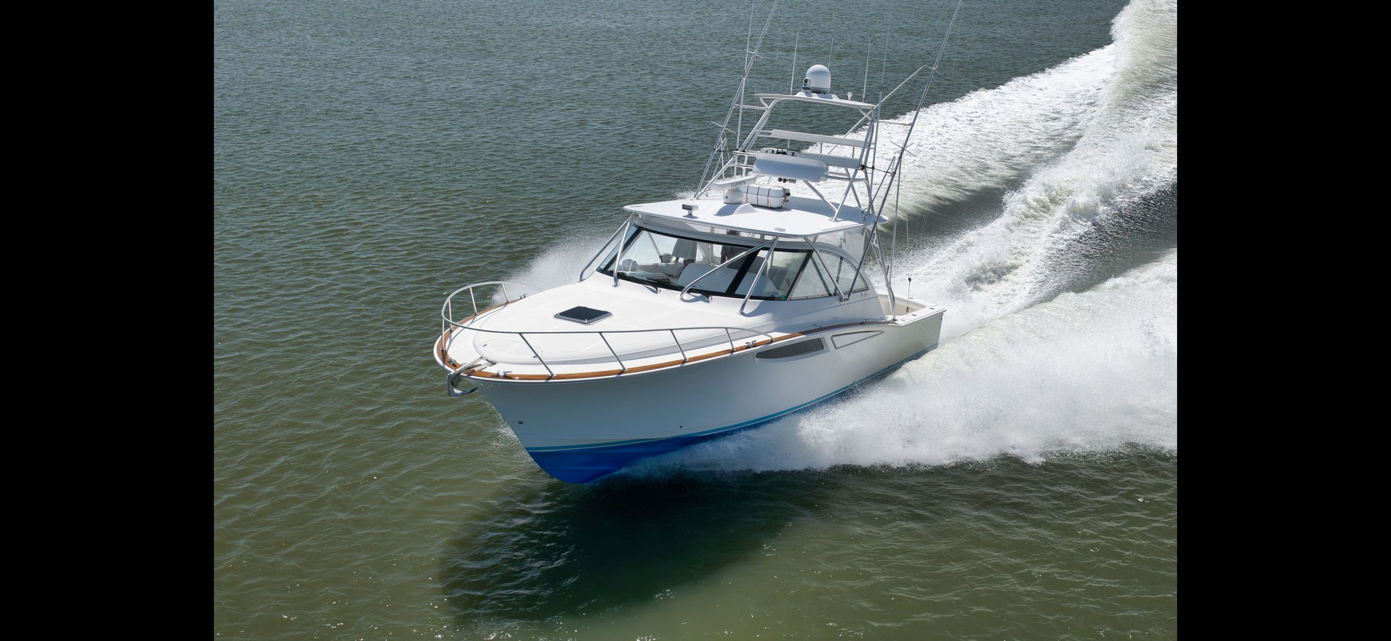 Mag Bay 42 Express 2022 cruising swiftly on water.