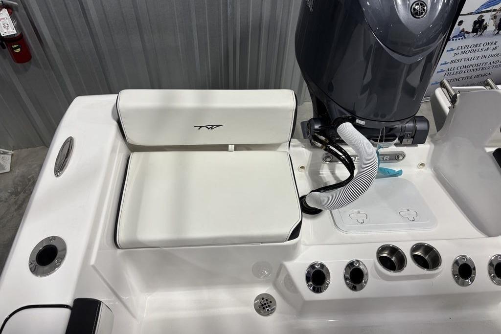 2026 Tidewater 198 CC Adventure boat interior with engine and seating area.