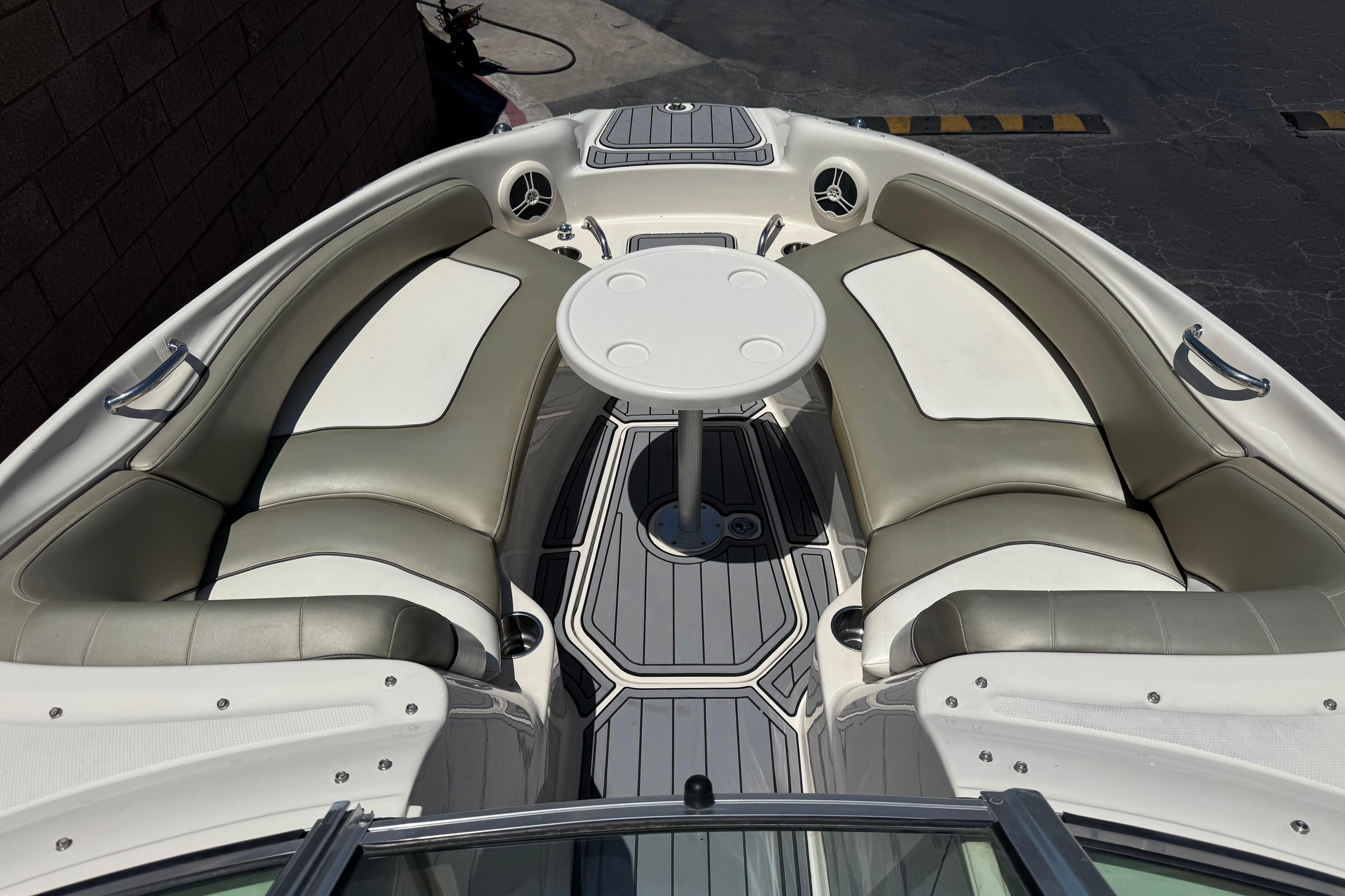 2007 Sea Ray 240 Sundeck boat interior with seating and table.