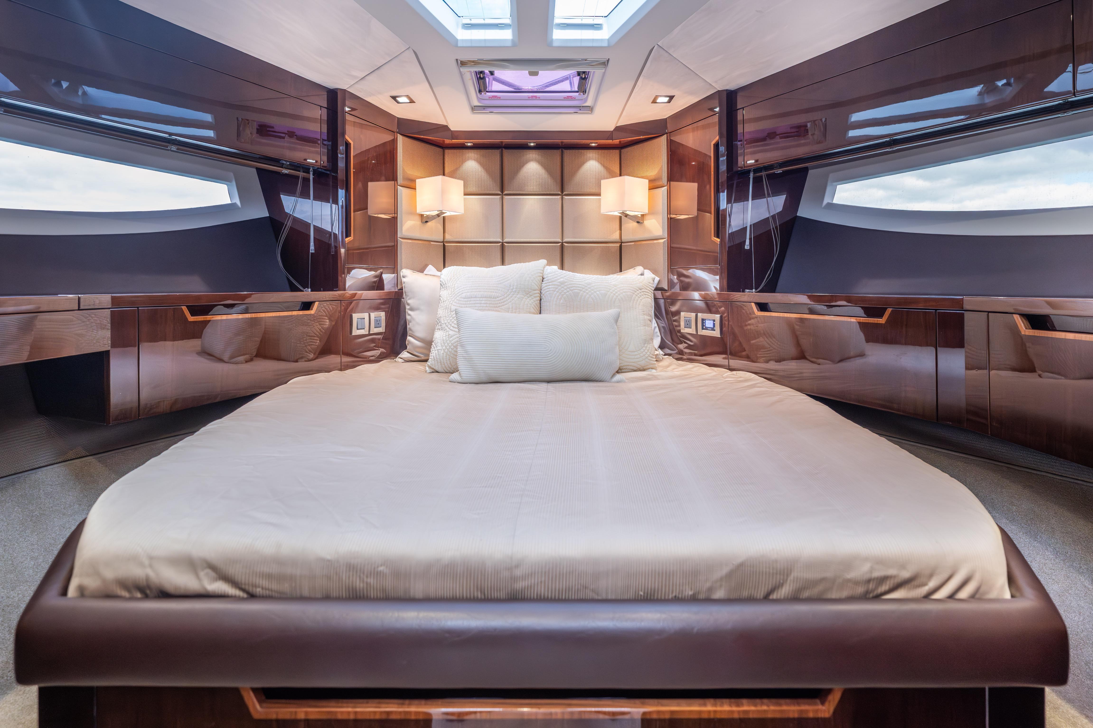 Luxurious bedroom interior of 2020 Galeon 500 Fly yacht with elegant design.