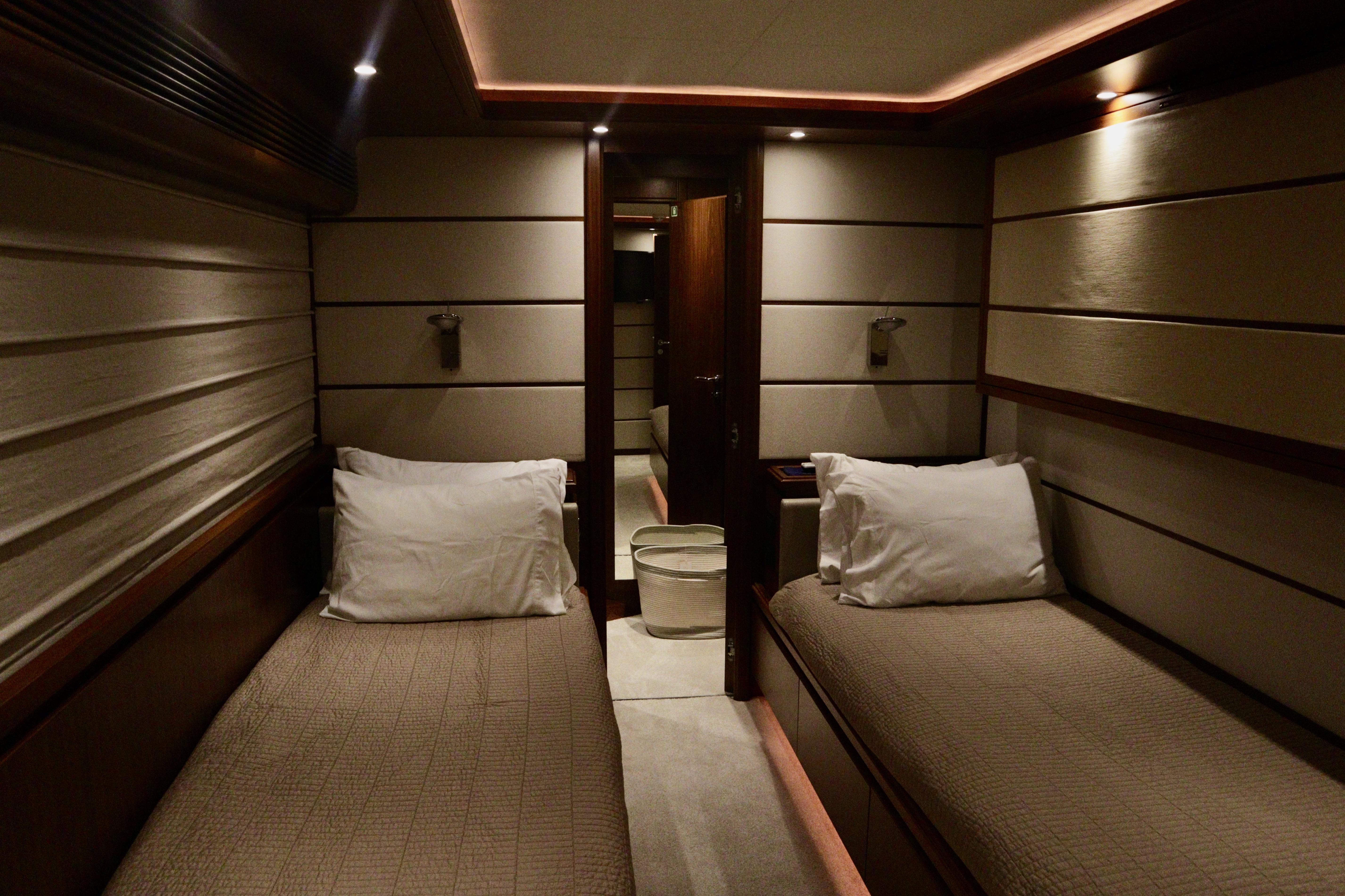 Luxurious twin cabin interior on 2016 Custom Line 97 yacht.
