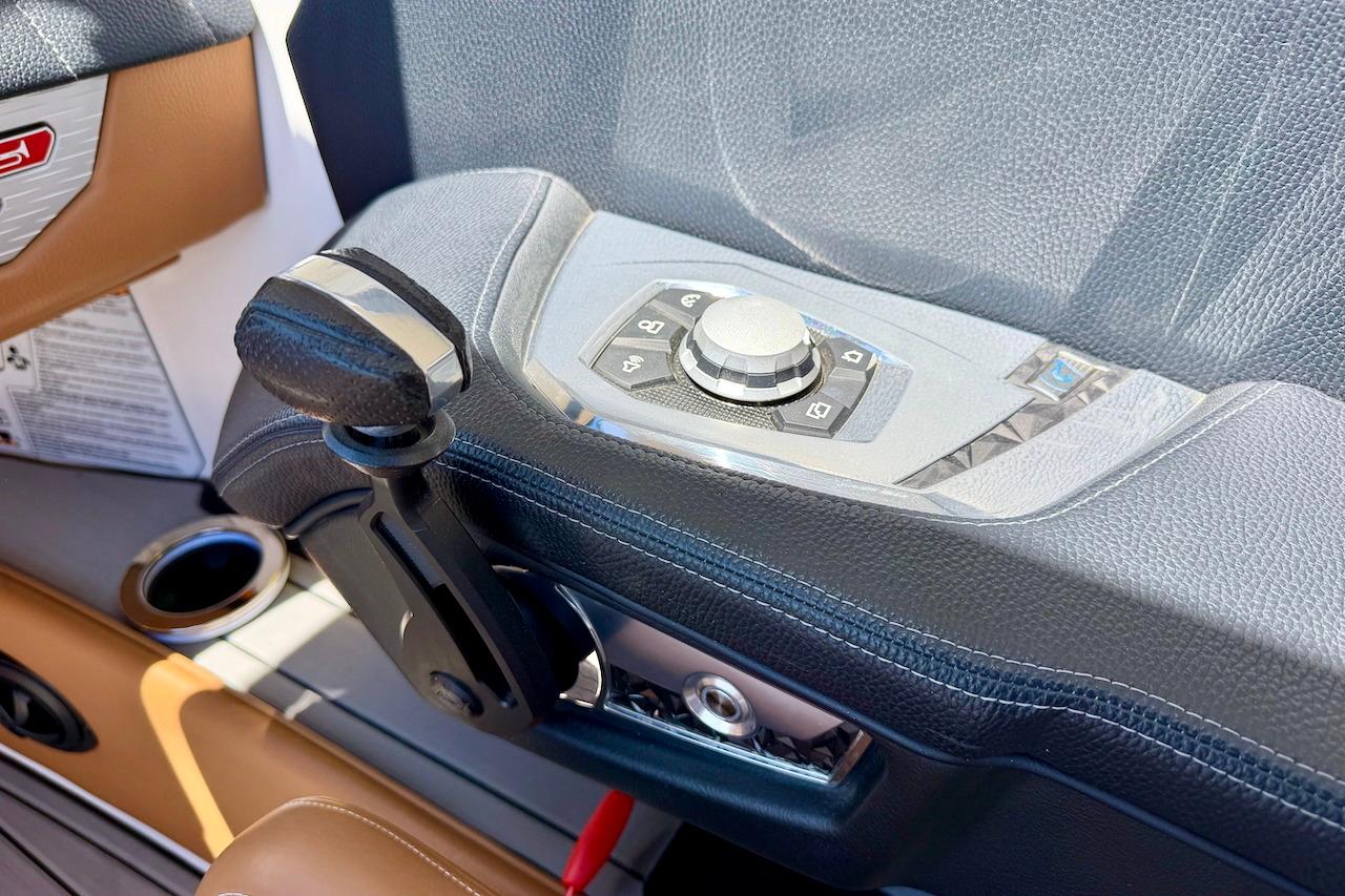 Control panel of 2021 Nautique Super Air Nautique G23 boat, featuring sleek design and controls.