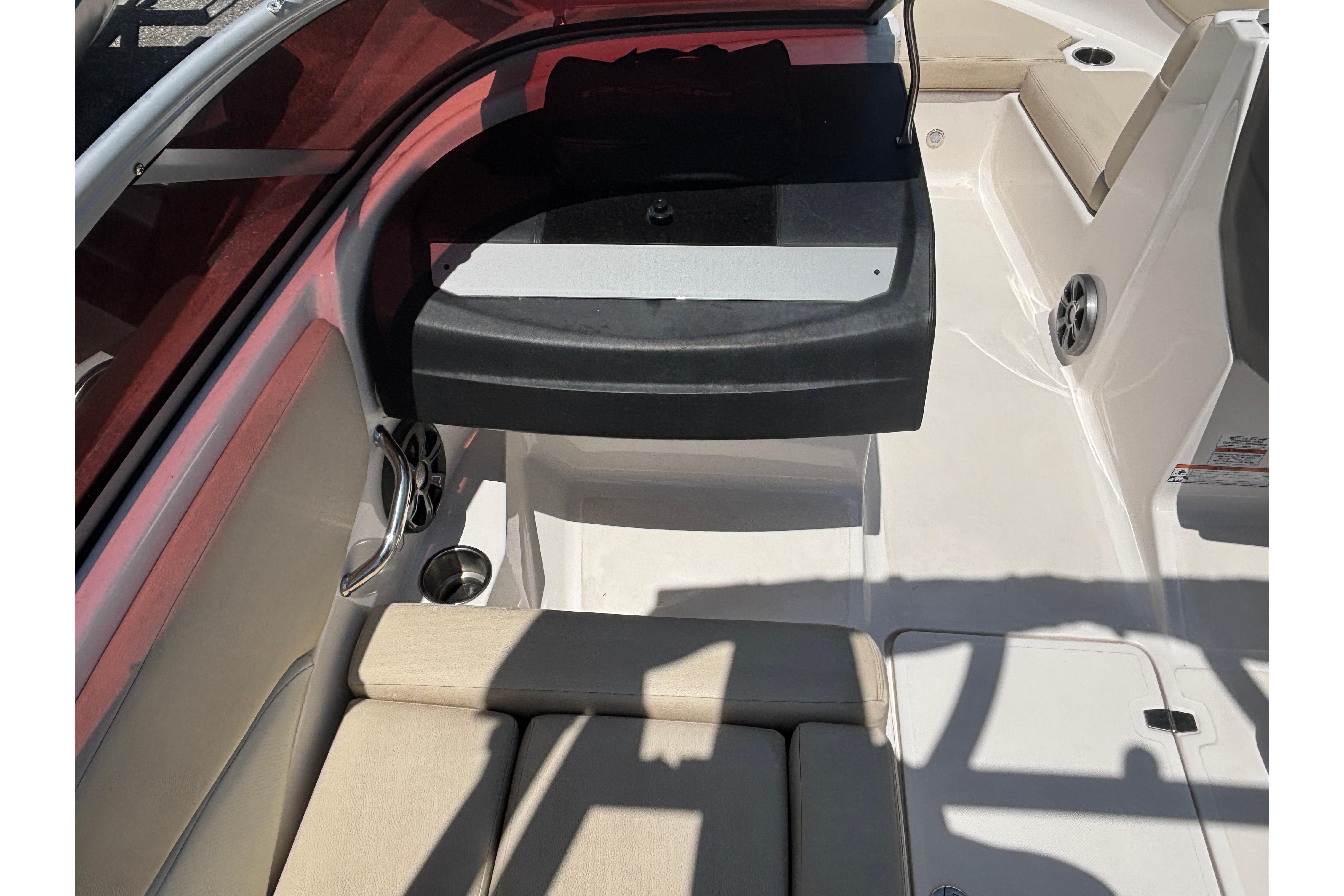 2018 Regal 1900 ES Bowrider interior with beige seating and cup holders.