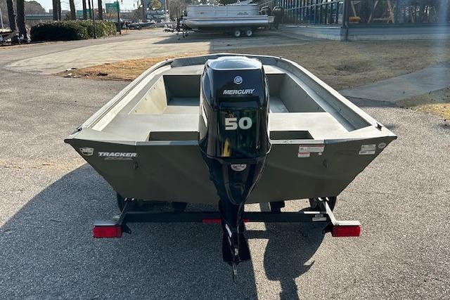2026 Tracker Grizzly 1860 Utility boat with Mercury 50 outboard motor on trailer.