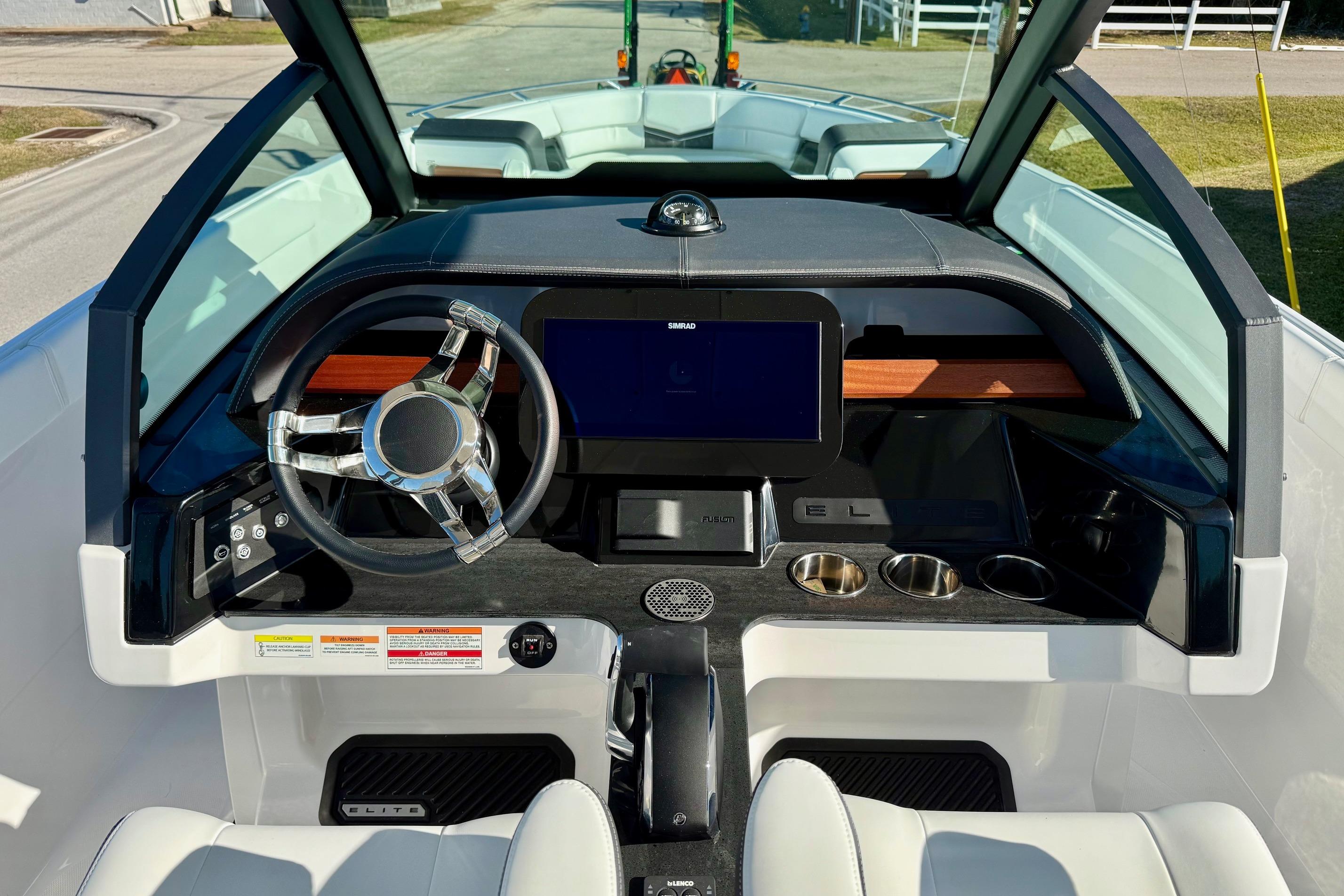 2026 Monterey Elite 27 OB cockpit with modern steering wheel and display.