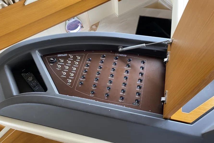 Control panel of a 2014 Azimut 45 yacht, featuring multiple switches and a remote control.