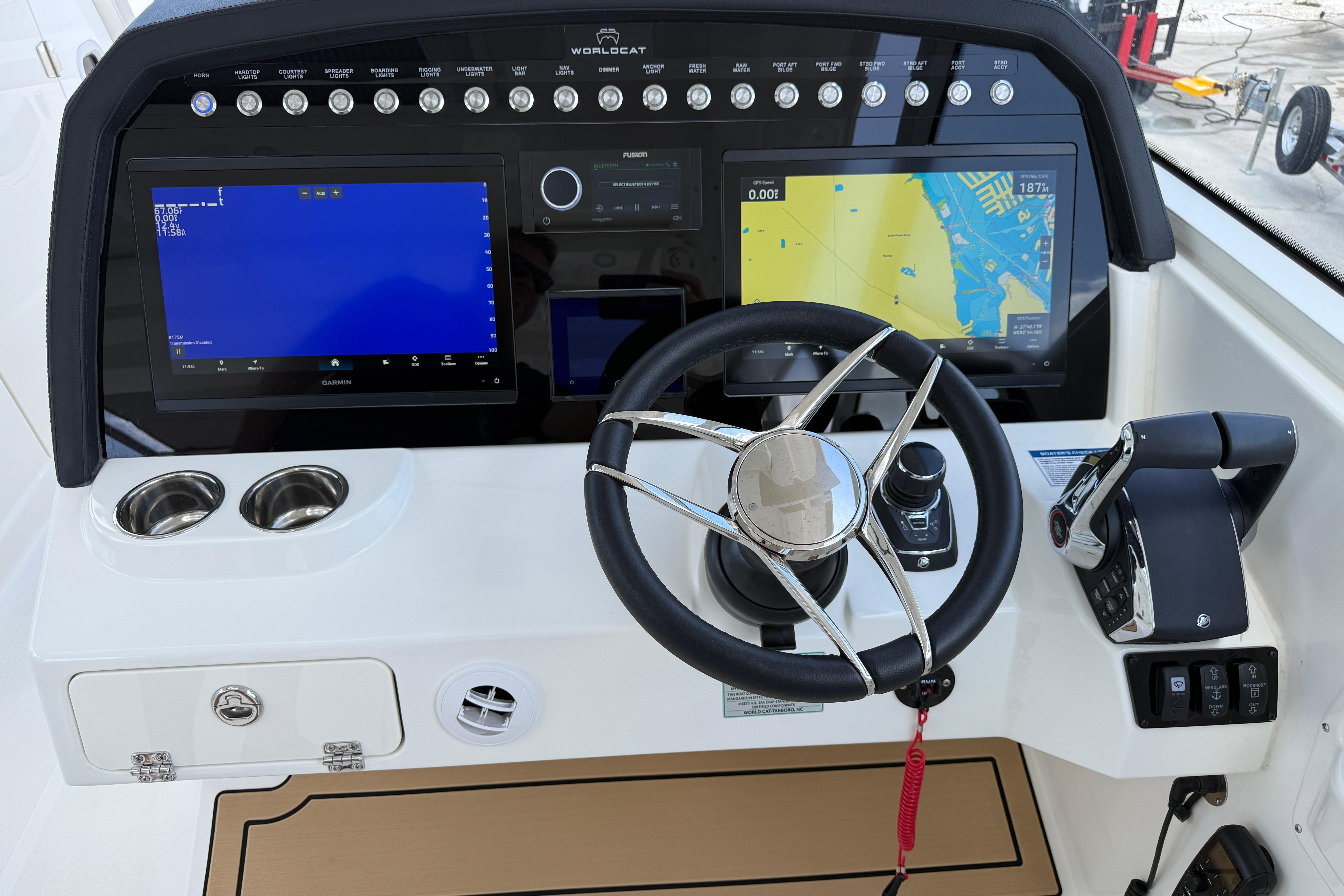 Helm of 2026 World Cat 400 DC-X Island with advanced navigation displays.