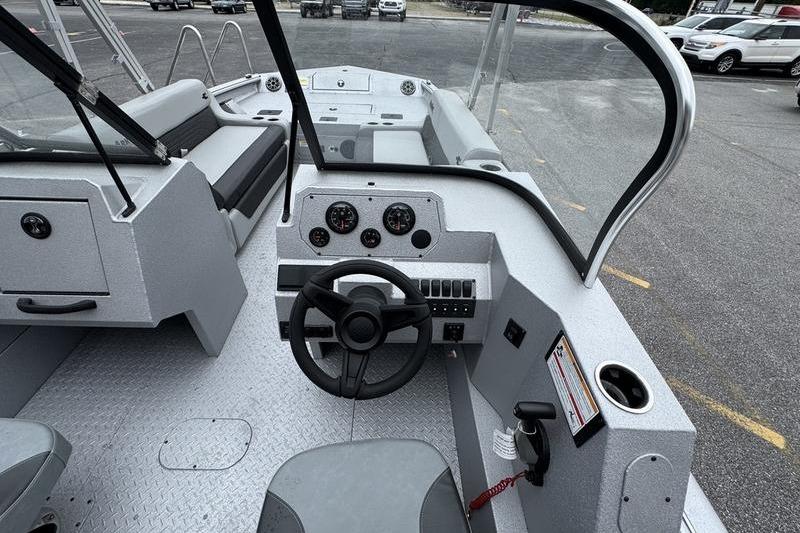 2025 SeaArk Super Lounge Easy boat interior with steering wheel and dashboard controls.
