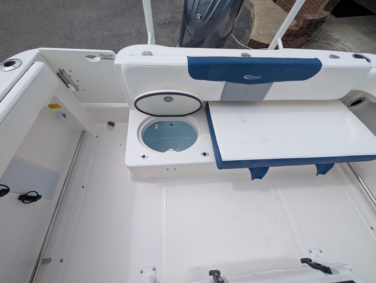 2025 Robalo R222 Explorer boat interior with seating and storage compartments.