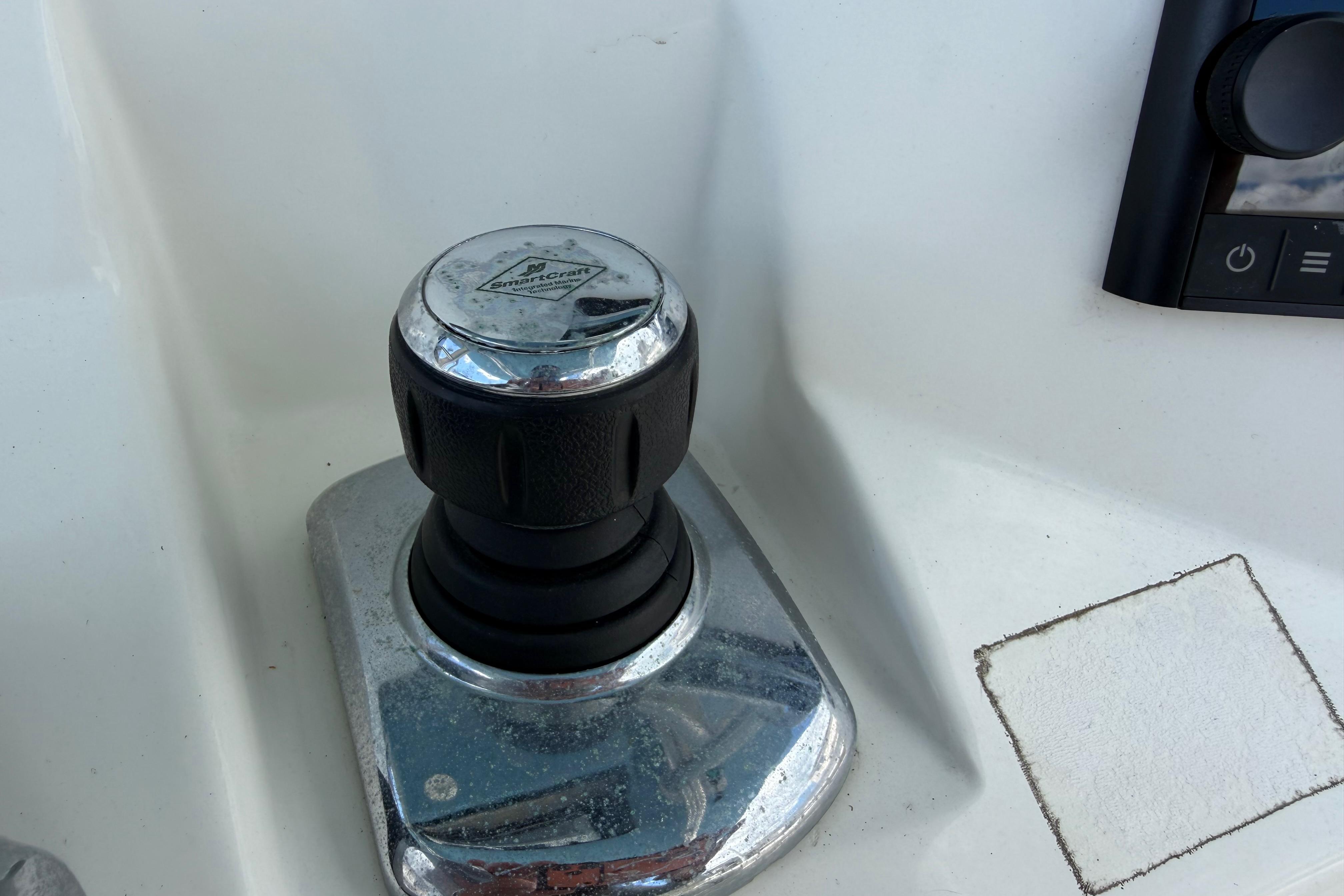 Close-up of a 2017 Mako 284 Center Console boat control knob.