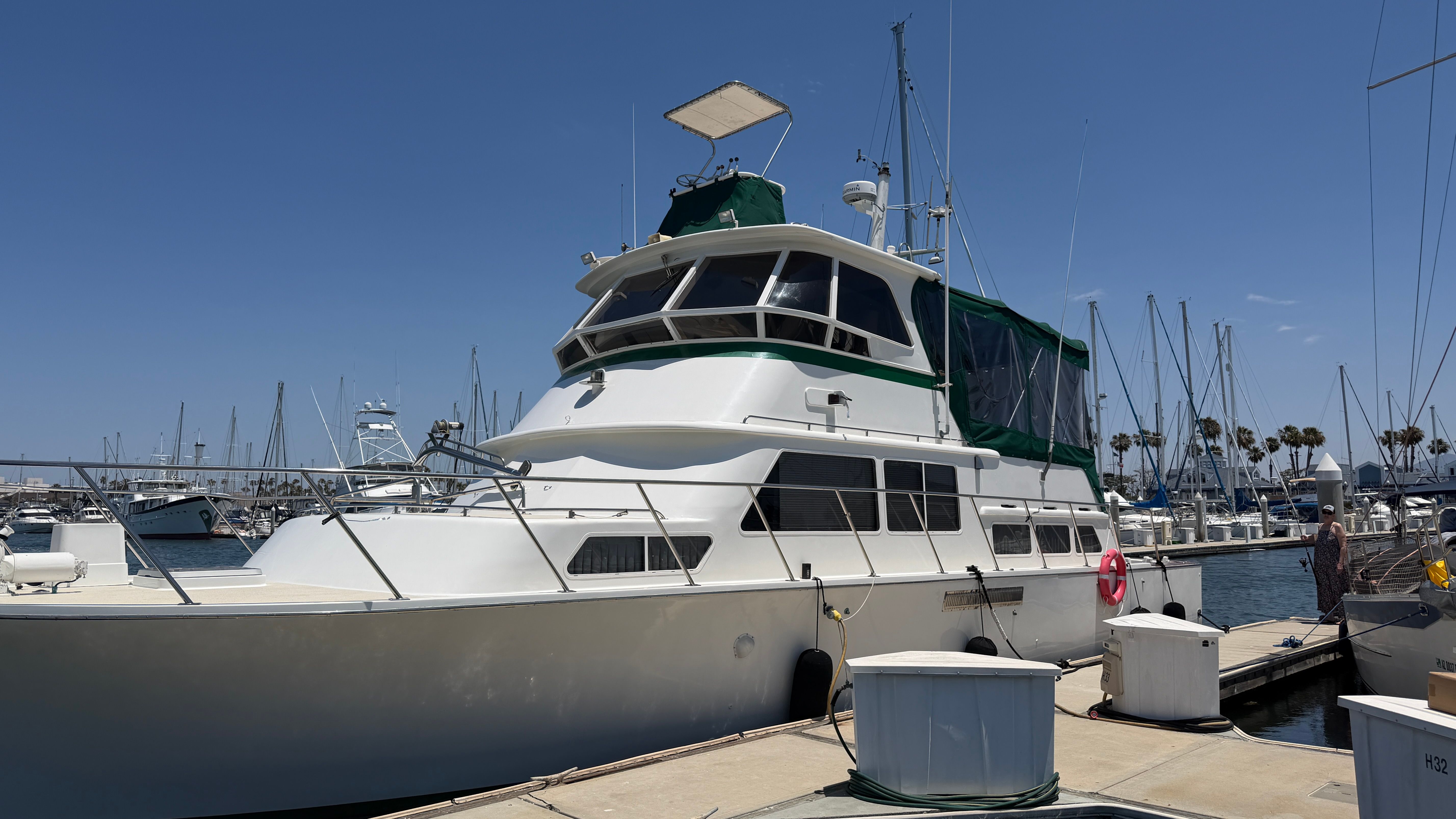 1966 Drake Yachtfisher docked at marina, sunny day.