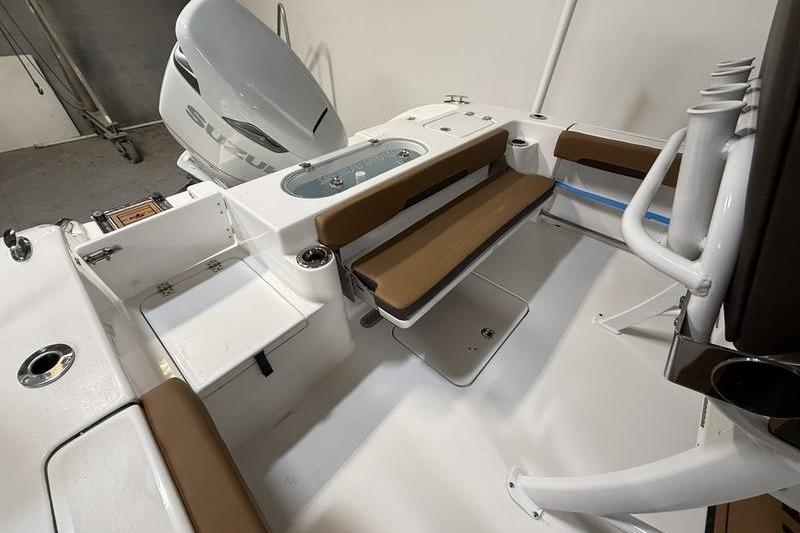 2026 Sea Pro 242 Center Console boat interior with seating and storage compartments.