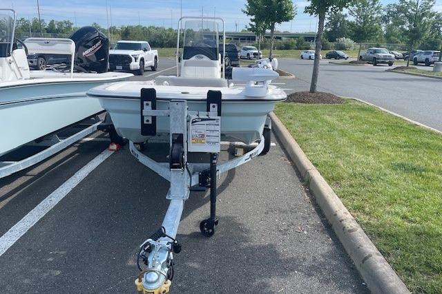 2026 Mako Pro Skiff 13 CC boat on trailer in parking lot.