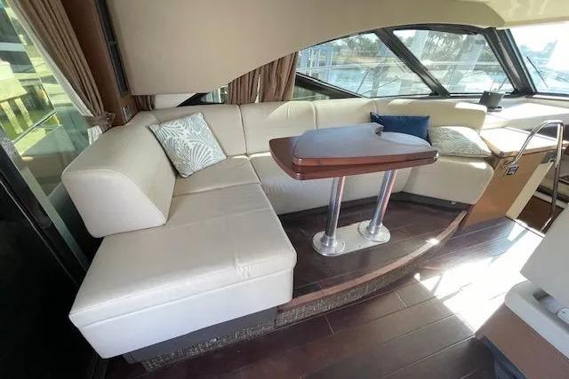 Luxurious interior of 2016 Sea Ray Sundancer 510 yacht with elegant seating and table.