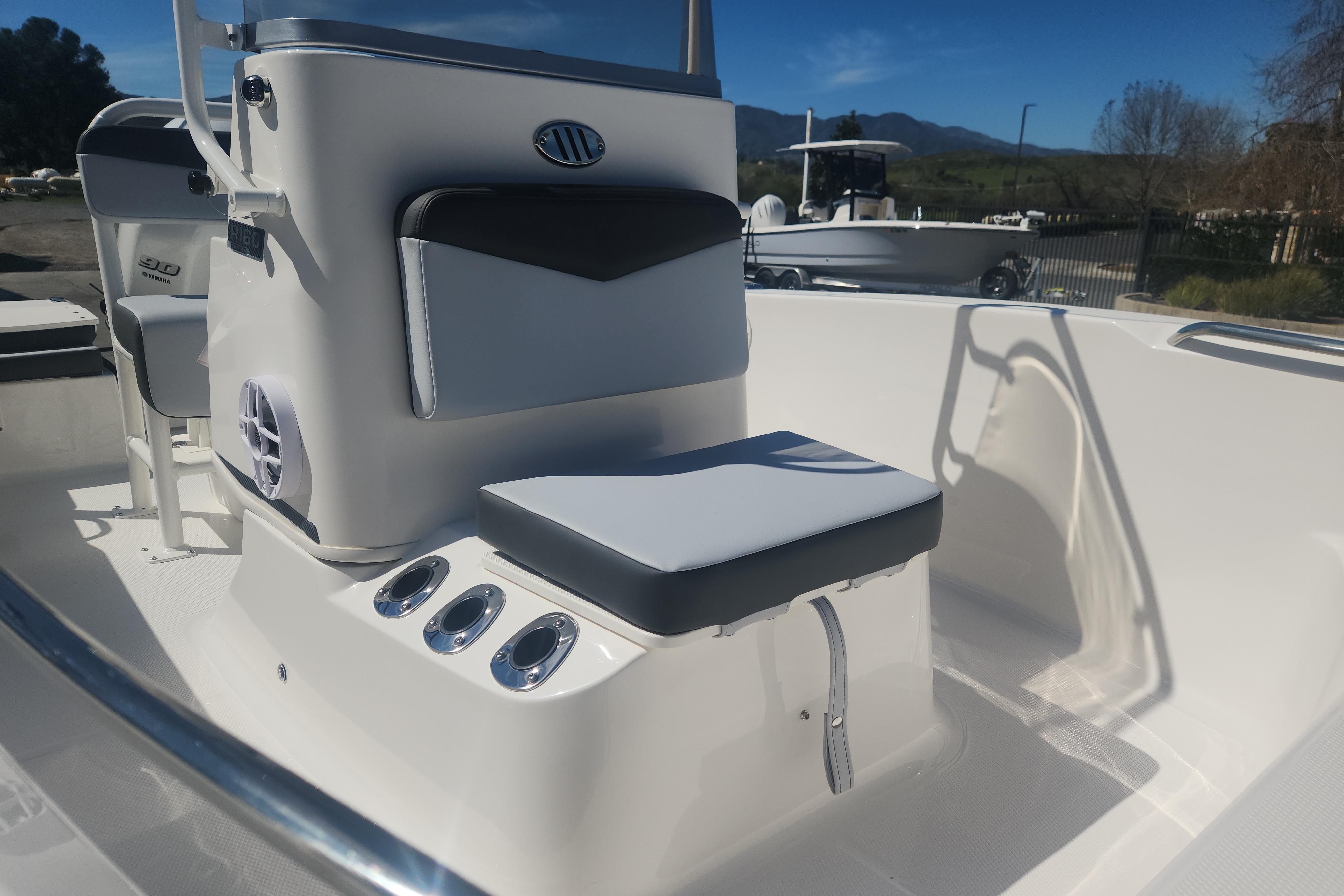 2026 Robalo R160 Center Console boat interior with seating and console details.
