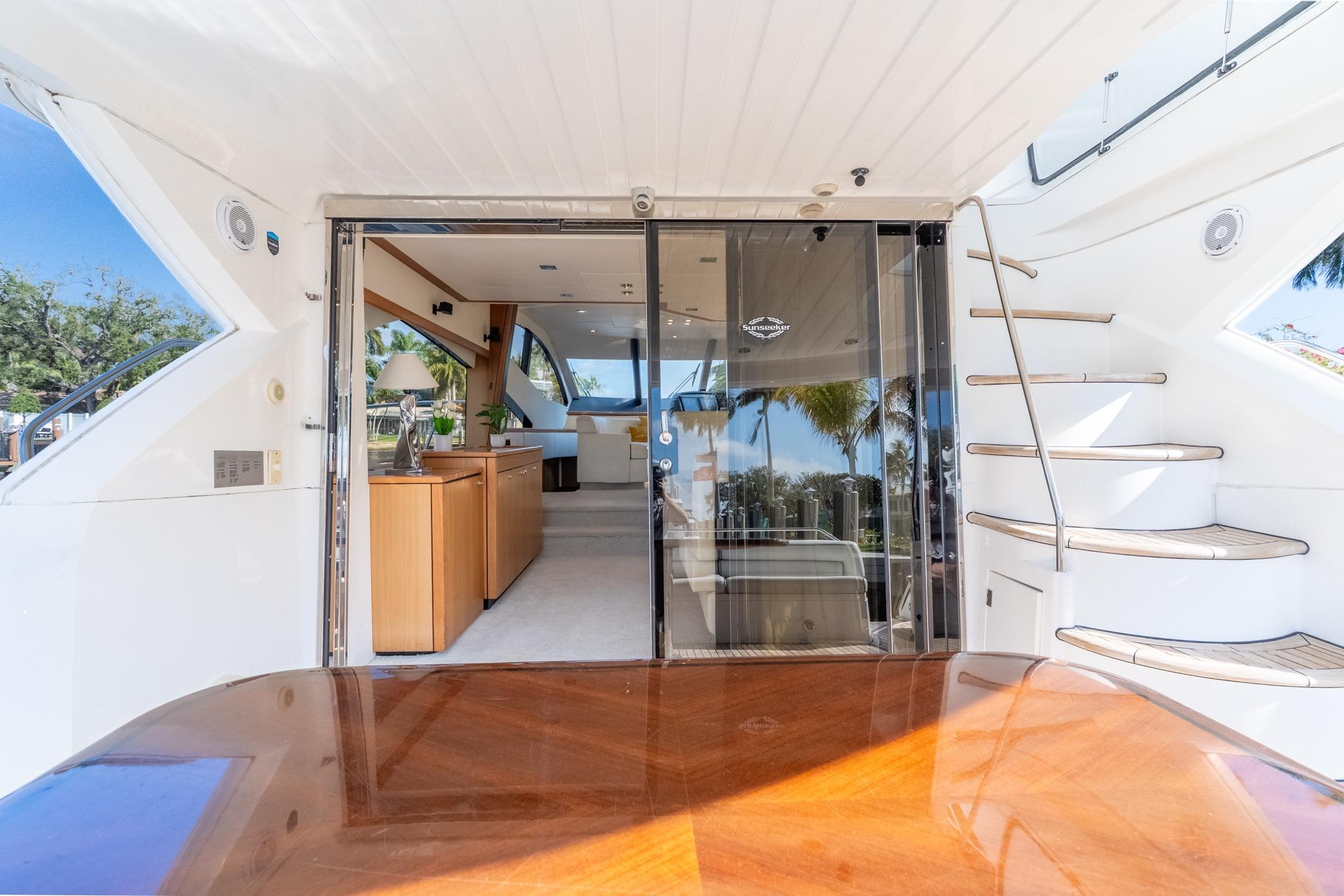 Luxurious 2009 Sunseeker Manhattan 60 yacht interior with elegant wood finishes and modern design.