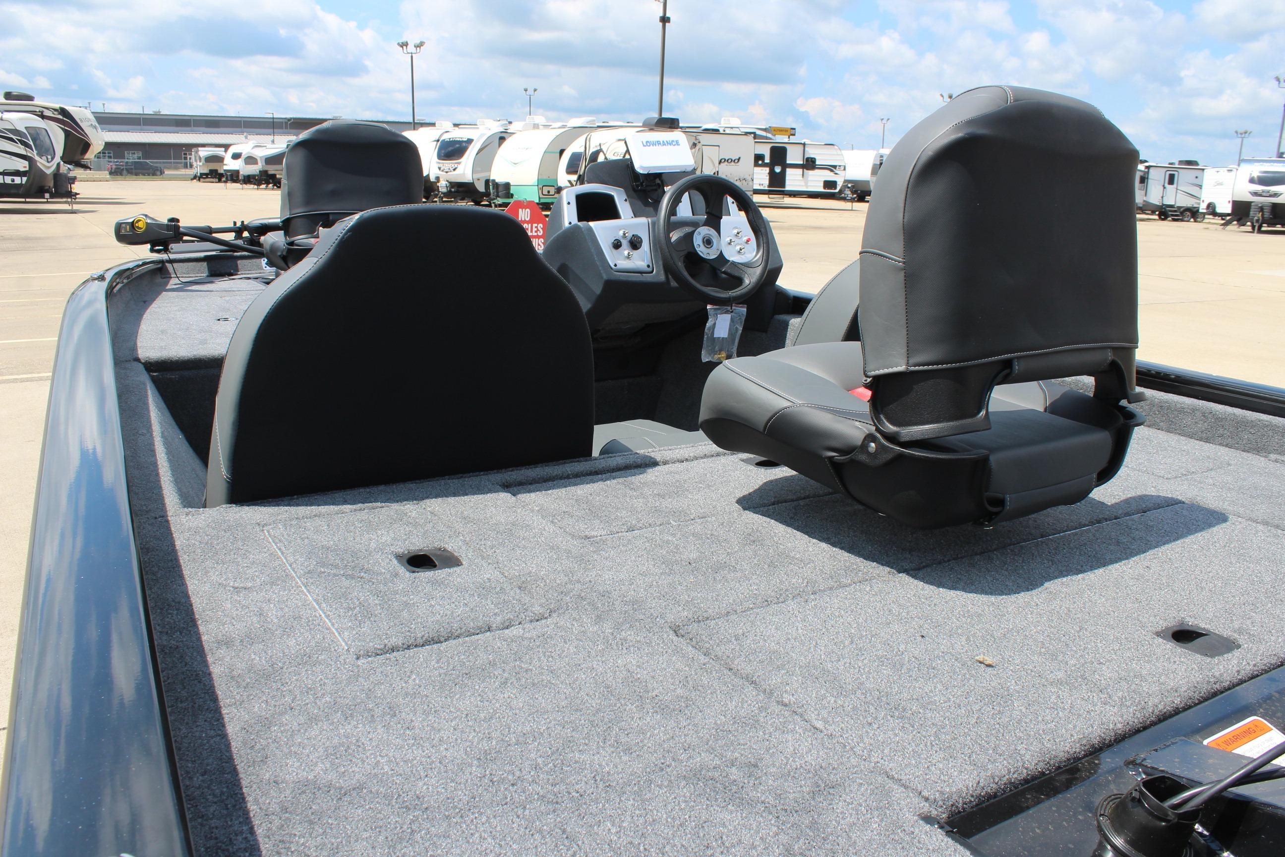 2026 Tracker Pro Team 175 boat interior with seating and steering console.