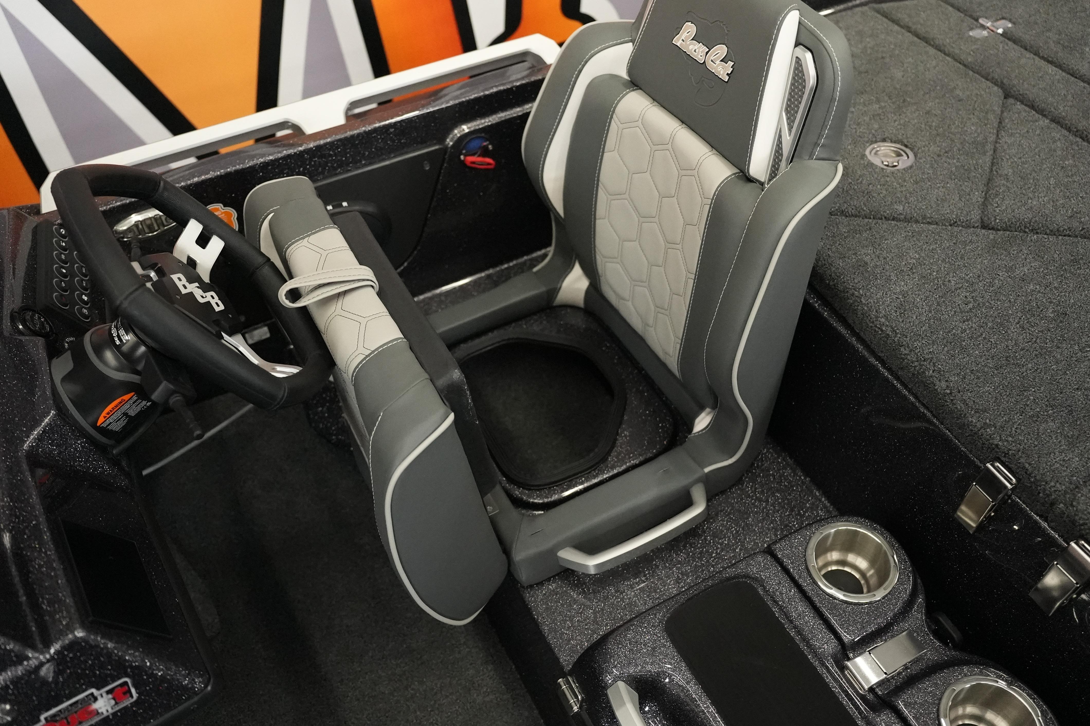 2026 Bass Cat Puma STS boat interior with steering wheel and seating detail.