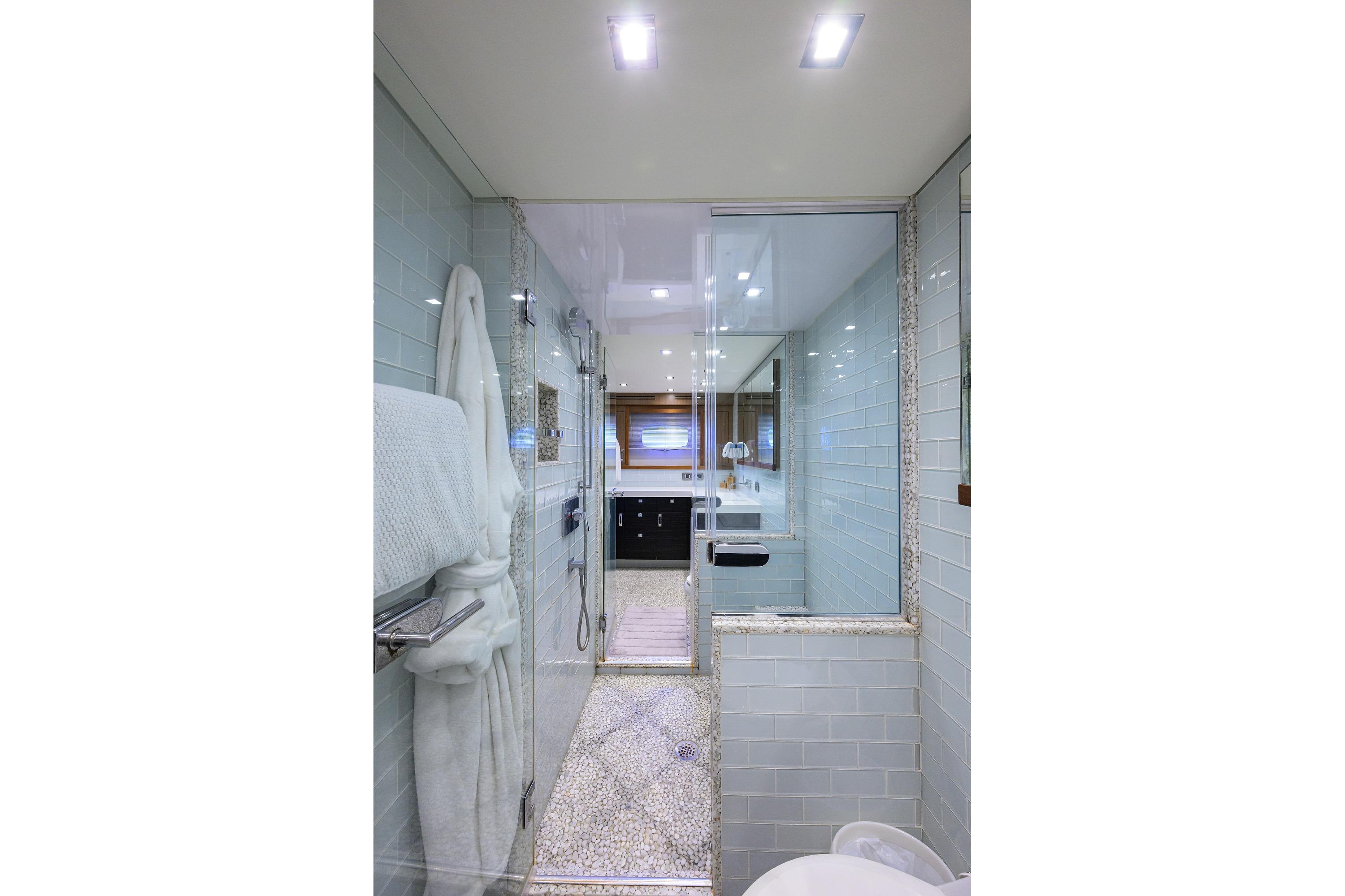 Luxurious bathroom interior of 2013 Hatteras 80 Motor Yacht with modern fixtures.